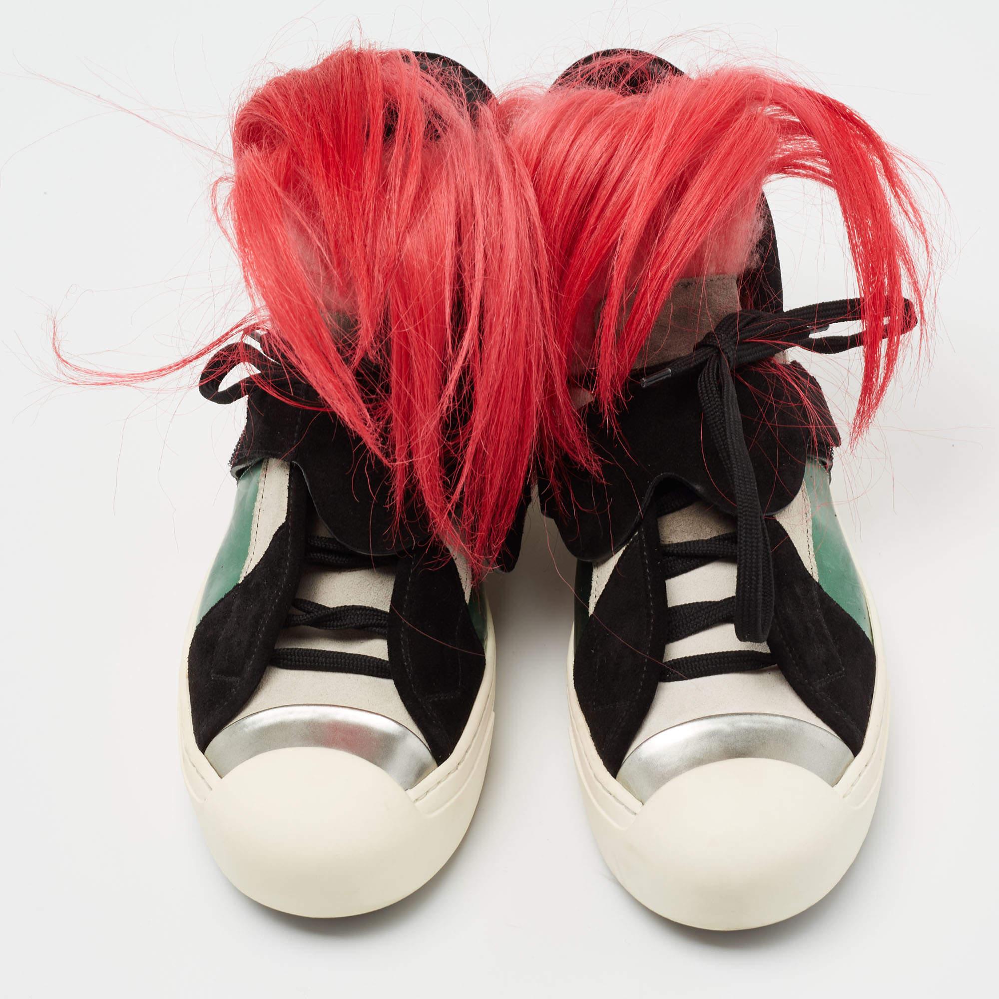 Modeled on fashion icon Karl Lagerfeld, the Karlito range of designs from Fendi is fun and full of character. These sneakers come crafted from suede and leather with fox fur detailing on the laced uppers. They also feature 