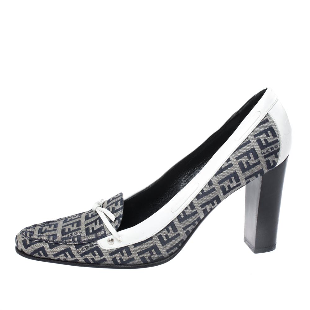 This pair of pumps by Fendi will let you make the most amazing style statement. They are crafted from Zucca coated canvas and leather trims featuring square toes and block heels. Add a dressy touch to your daily outfit with these exquisite pumps.

