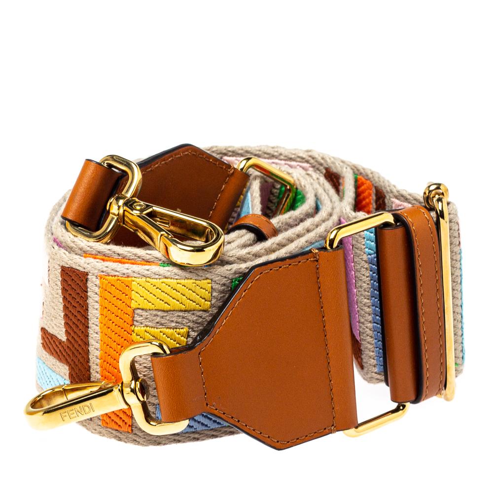 Words fall short in describing this exquisite guitar strap from Fendi! Crafted with love from canvas and leather, the strap flaunts Zucca detailing in splendid hues. The piece is adjustable, and it has two clasps for you to attach to your