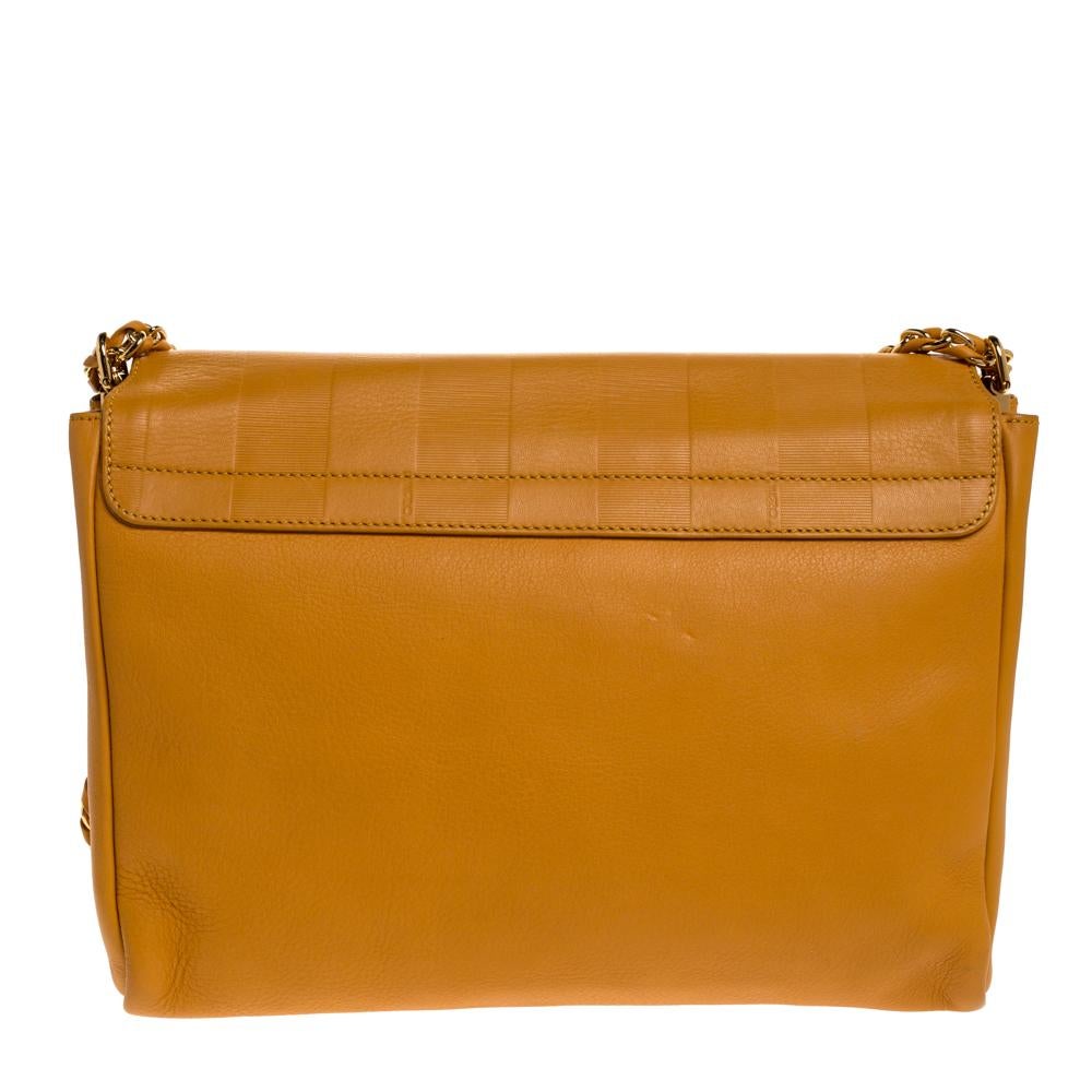 This bag by Fendi has been designed keeping the latest trends of the season. Carry this cool mustard-hued bag to complete your casual everyday look. Crafted with quality leather, this bag is sure to make an amazing style statement.

