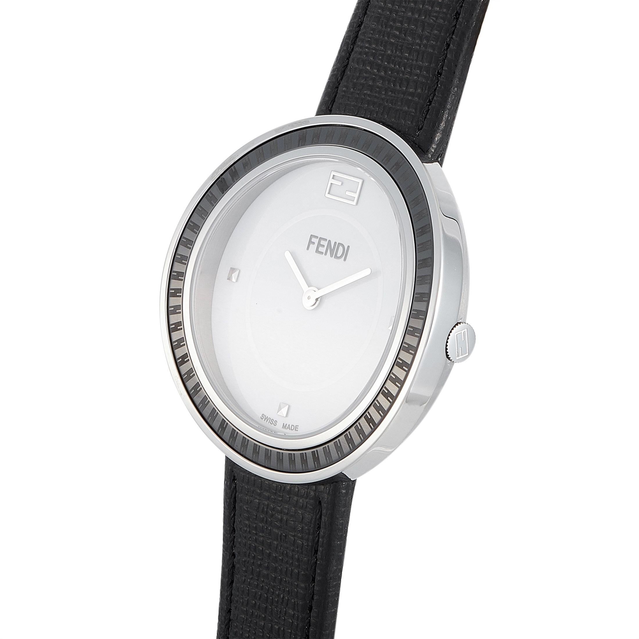 The Fendi My Way watch, reference number F352034011, boasts a 36 mm stainless steel case fitted with a black ceramic bezel. The case is presented on a black leather strap, secured on the wrist with a tang buckle. This model is powered by a quartz