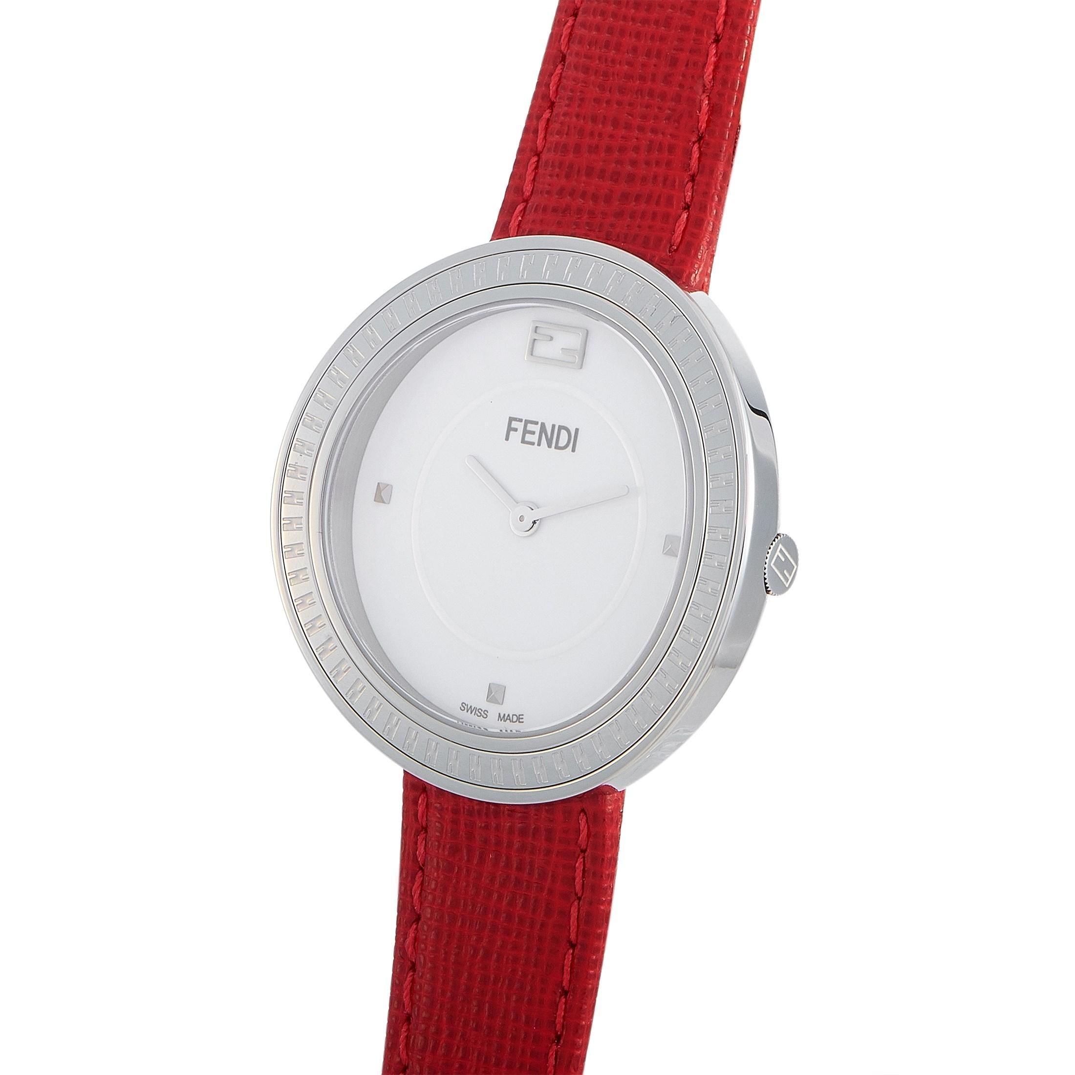 The Fendi My Way watch, reference number F354034073, boasts a 36 mm stainless steel case that is presented on a red leather strap, secured on the wrist with a tang buckle. This model is powered by a quartz movement and indicates hours and minutes on
