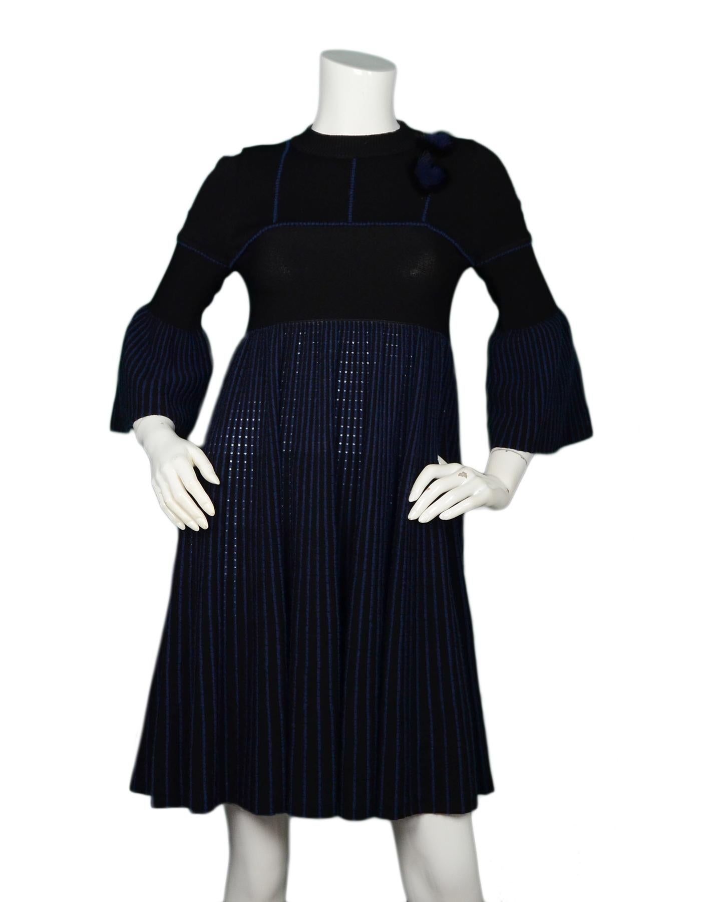Fendi Navy/Black Knit Dress W/ Mink Fur Heart Detail Sz IT38/US2

Made In: Italy
Color: Navy/black
Materials: 75% rayon, 15% polyester, 5% mohair, 4% nylon, 2% wool
Opening/Closure: Pull over with two back neck buttons
Overall Condition: Excellent