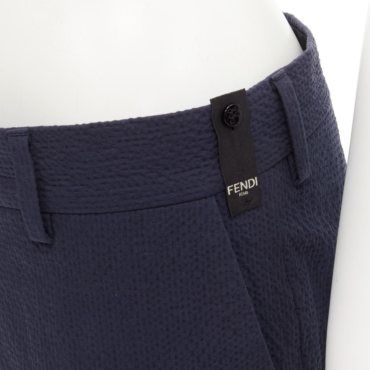 FENDI navy blue seersucker cotton blend trousers pants IT44 XS
Reference: CRTI/A00731
Brand: Fendi
Material: Cotton, Blend
Color: Blue
Pattern: Solid
Closure: Zip
Made in: Italy

CONDITION:
Condition: Excellent, this item was pre-owned and is in