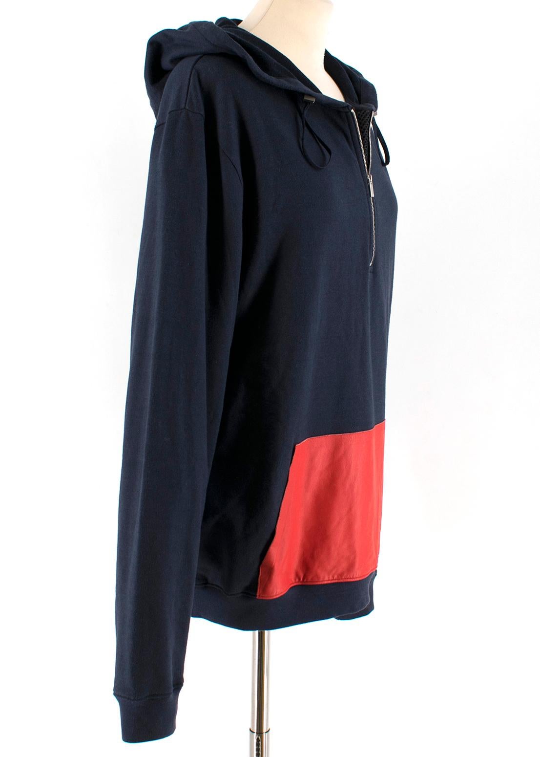 Fendi Navy Sweatshirt with Red Contrast Pocket

Navy Sweatshirt  
Hood
Red leather front pocket
elasticated cuff and rim 
Mid zip closure with netting detailing 
Drawstring
Silver hardware
Authenticity label inside

Please note, these items are