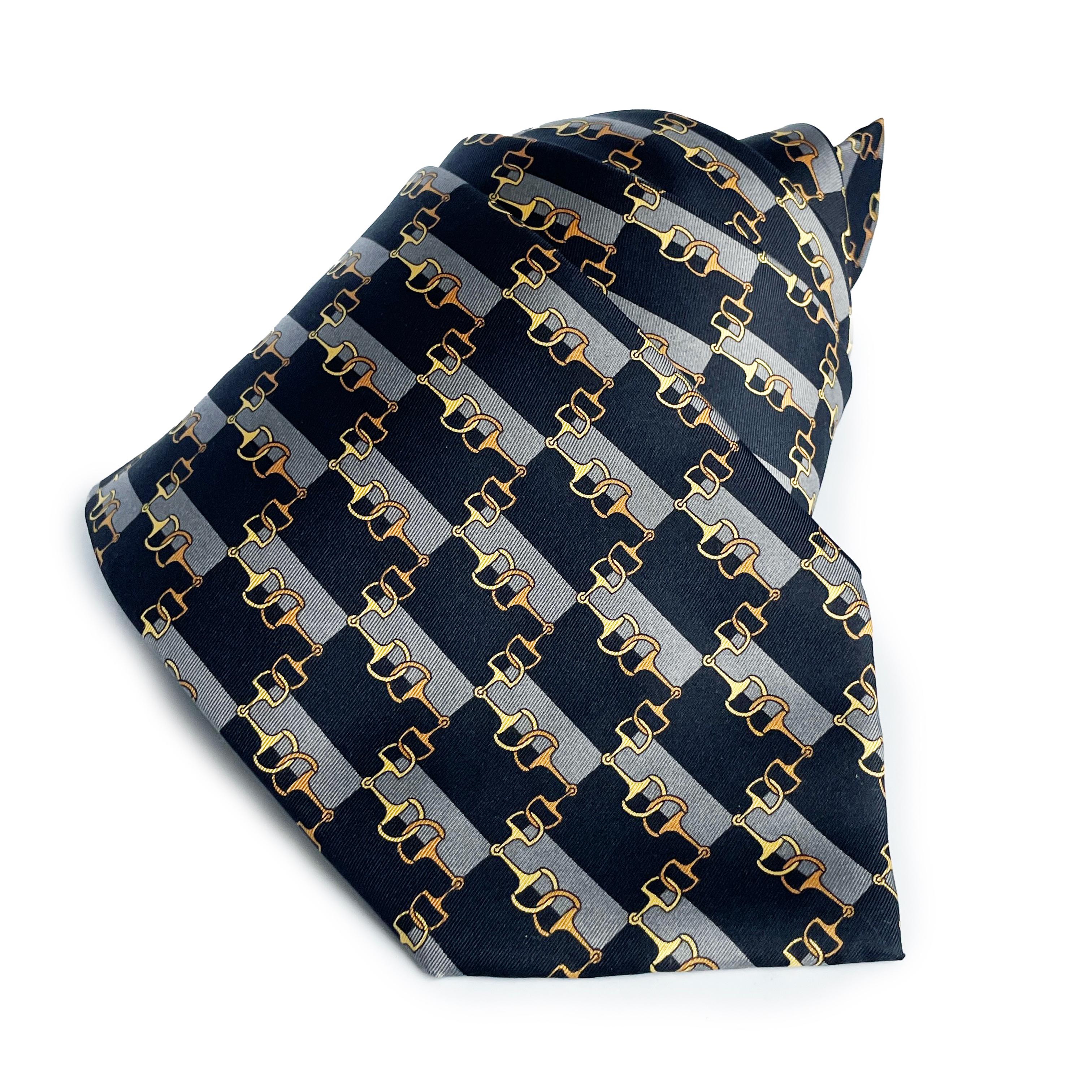 Preowned mens necktie by Fendi, likely made post 2000. Made from silk, it features an equestrian horse bit motif throughout.

Perfect for those of you who enjoy luxury accessories for work or play - or for those of you who collect.  The equestrian