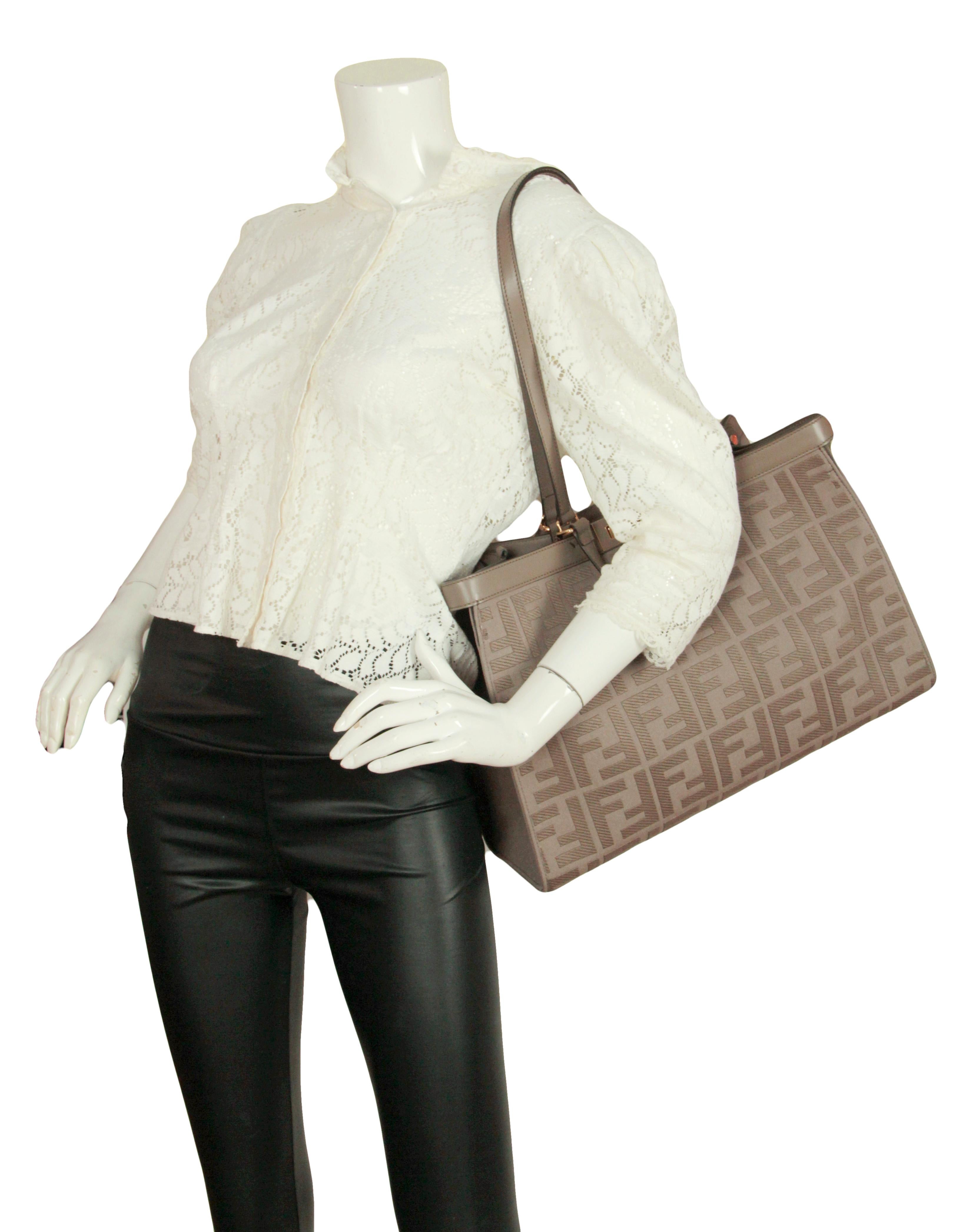 Fendi NEW 2021 Grey Canvas Monogram Peekaboo X-Tote Bag.  Long straps can be tucked in to wear handheld, or used for shoulder wear.

Made In: Italy
Color: Grey
Hardware: Goldtone
Materials: Canvas and calf leather
Lining: Grey