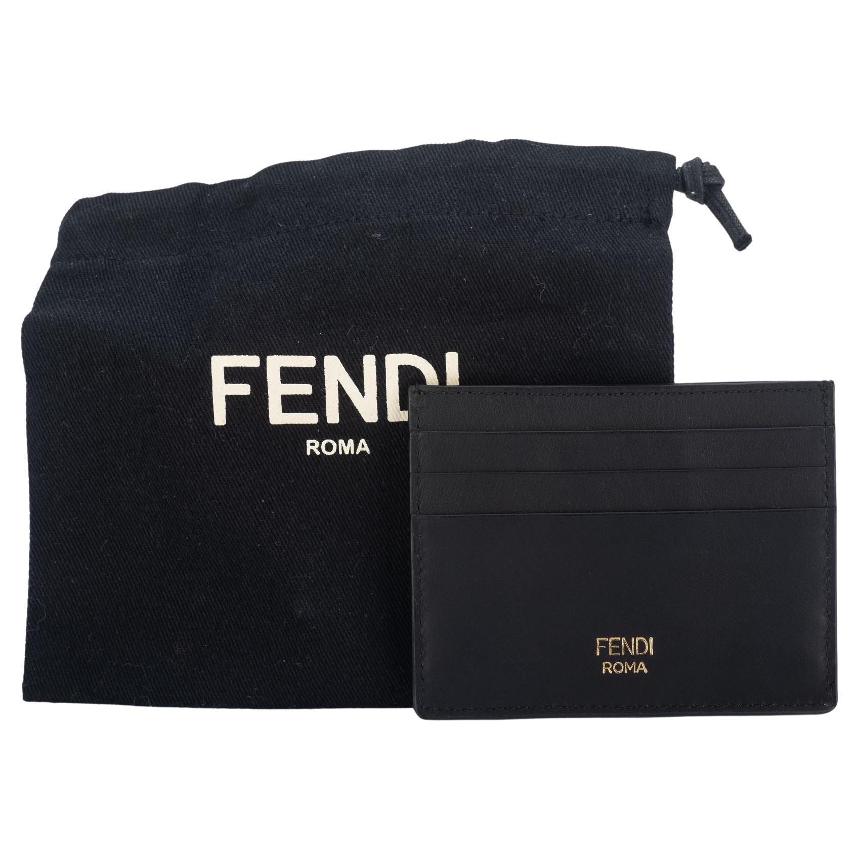 Fendi brad new limited edition matt black credit card monster case with gold eyes. Comes with original dust cover.