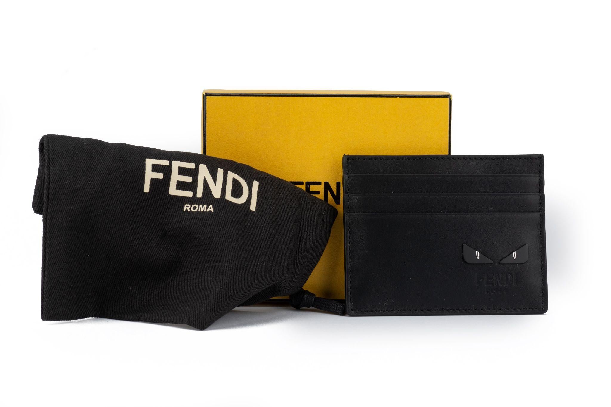 Fendi brad new limited edition matte black credit card monster case with gold eyes. Comes with original dust cover.