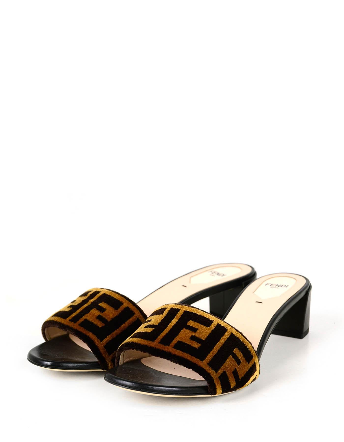 Fendi NEW Logo Print Velvet & Leather Mules

Made In: Italy
Color: Brown
Materials: Velvet & leather
Closure/Opening: Slip-on
Overall Condition: New.  Does not include box or dustbag.
Estimated Retail: $650

Marked Size: 39.5
Heel Height: 2”