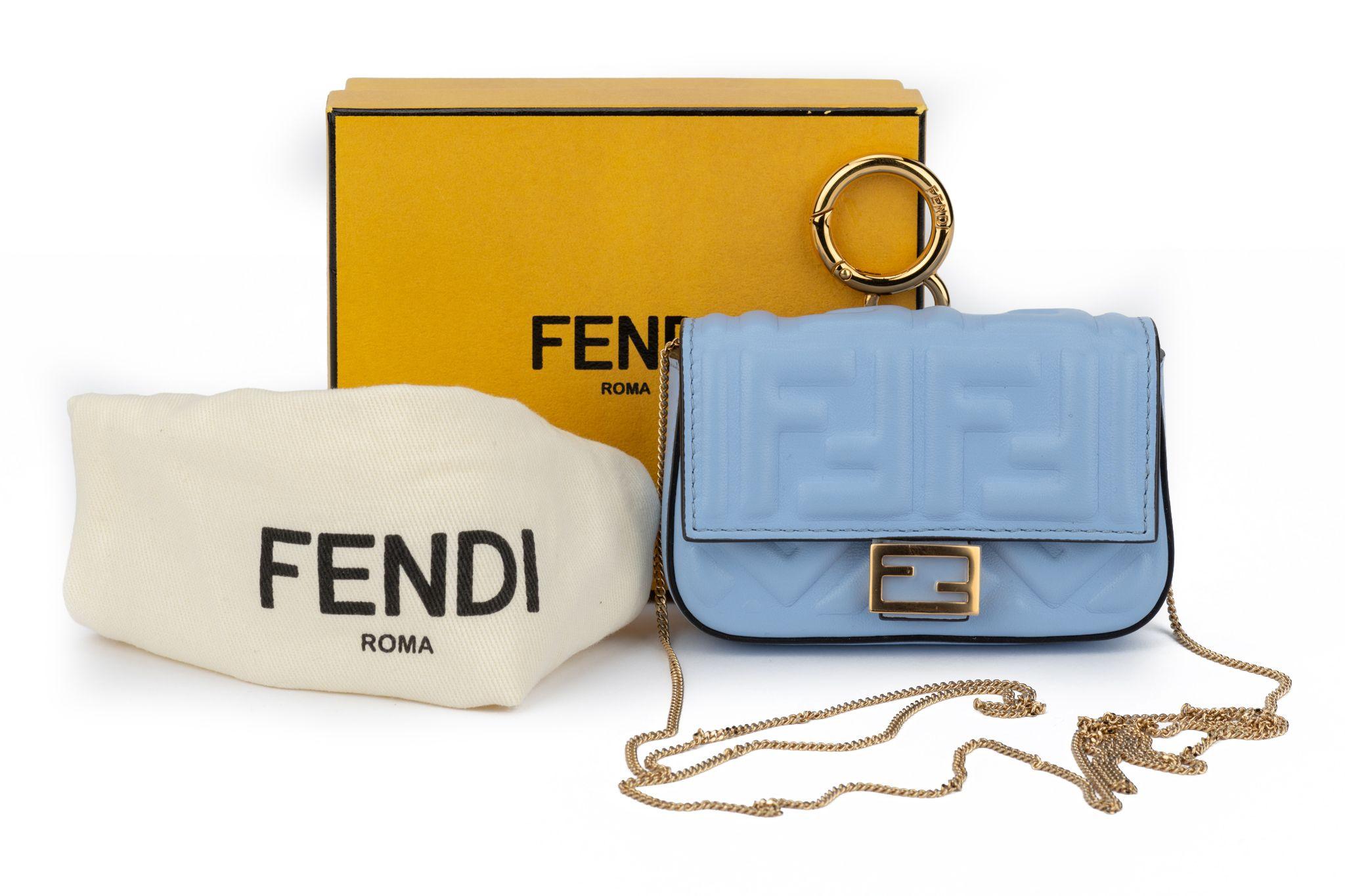 Fendi celeste embossed logo nano baguette, gold tone hardware. 
Detachable shoulder strap measures 22