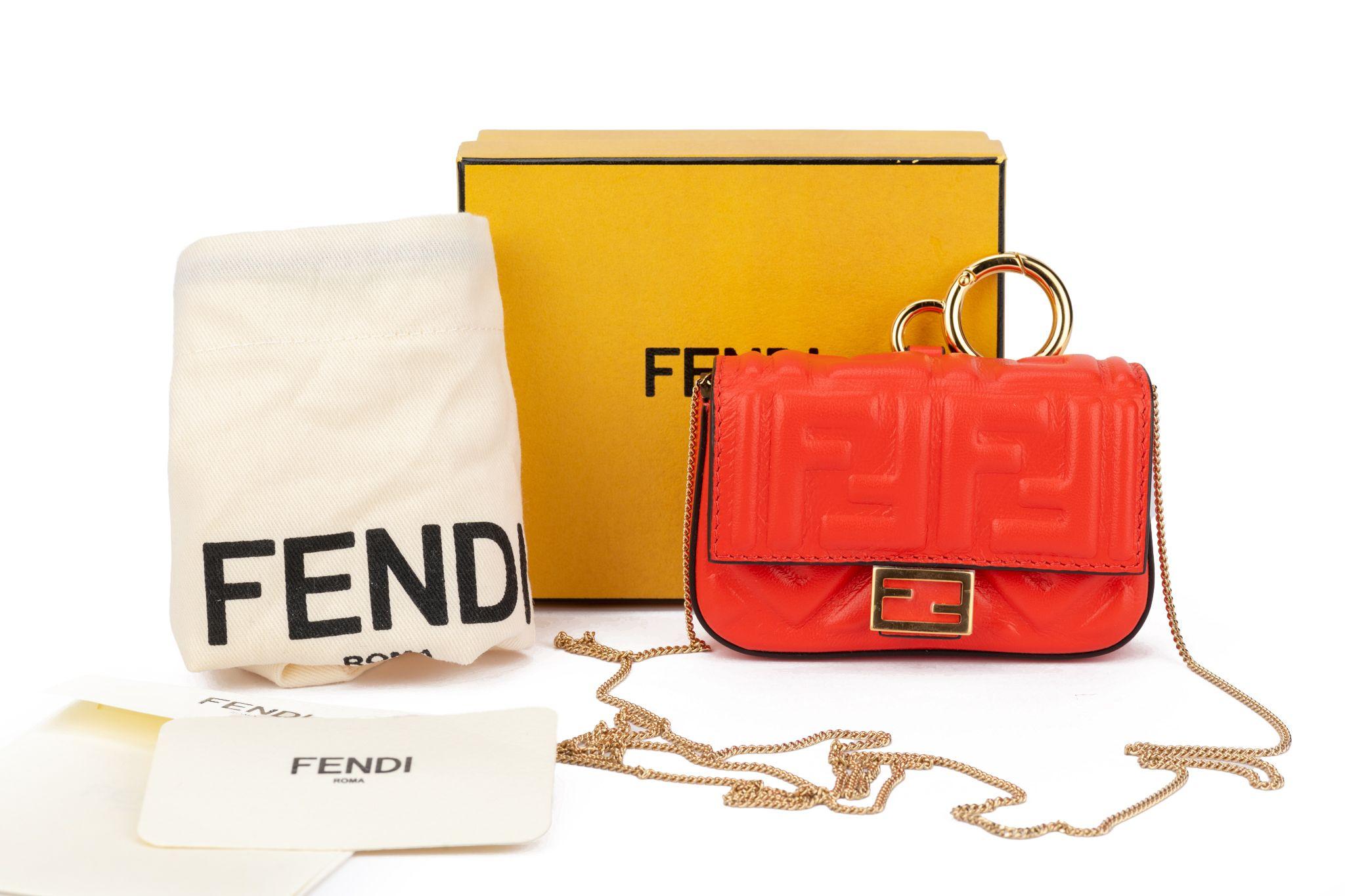 Fendi coral embossed logo nano baguette, gold tone hardware. 
Detachable shoulder strap measures 22