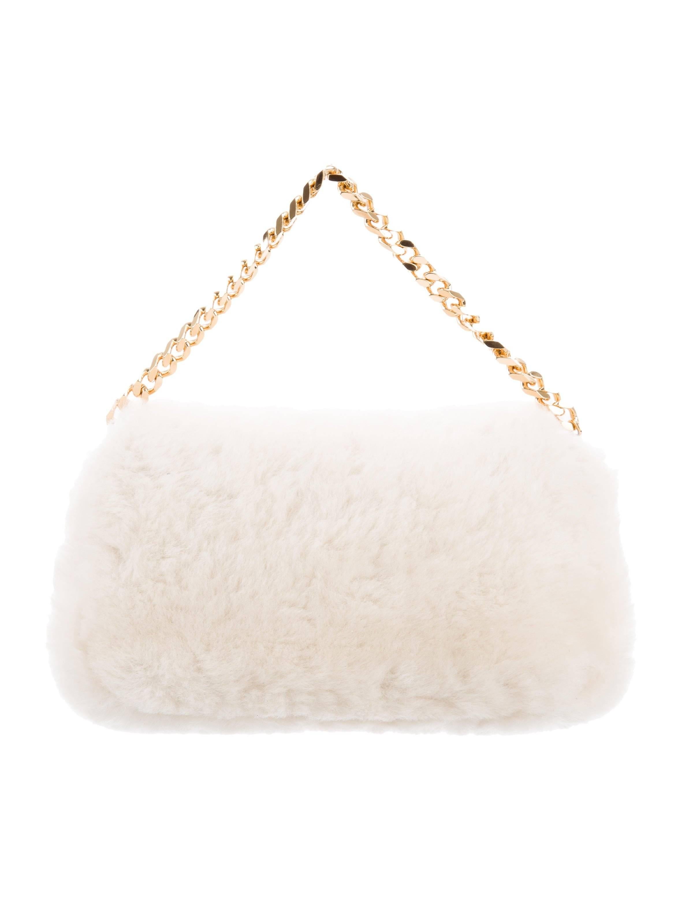 Fendi NEW Winter White Fur Gold 2 in 1 Clutch Evening Handle Chain Flap Bag

Shearling fur 
Leather trim
Gold tone hardware
Suede lining 
Made in Italy
Chain drop 3