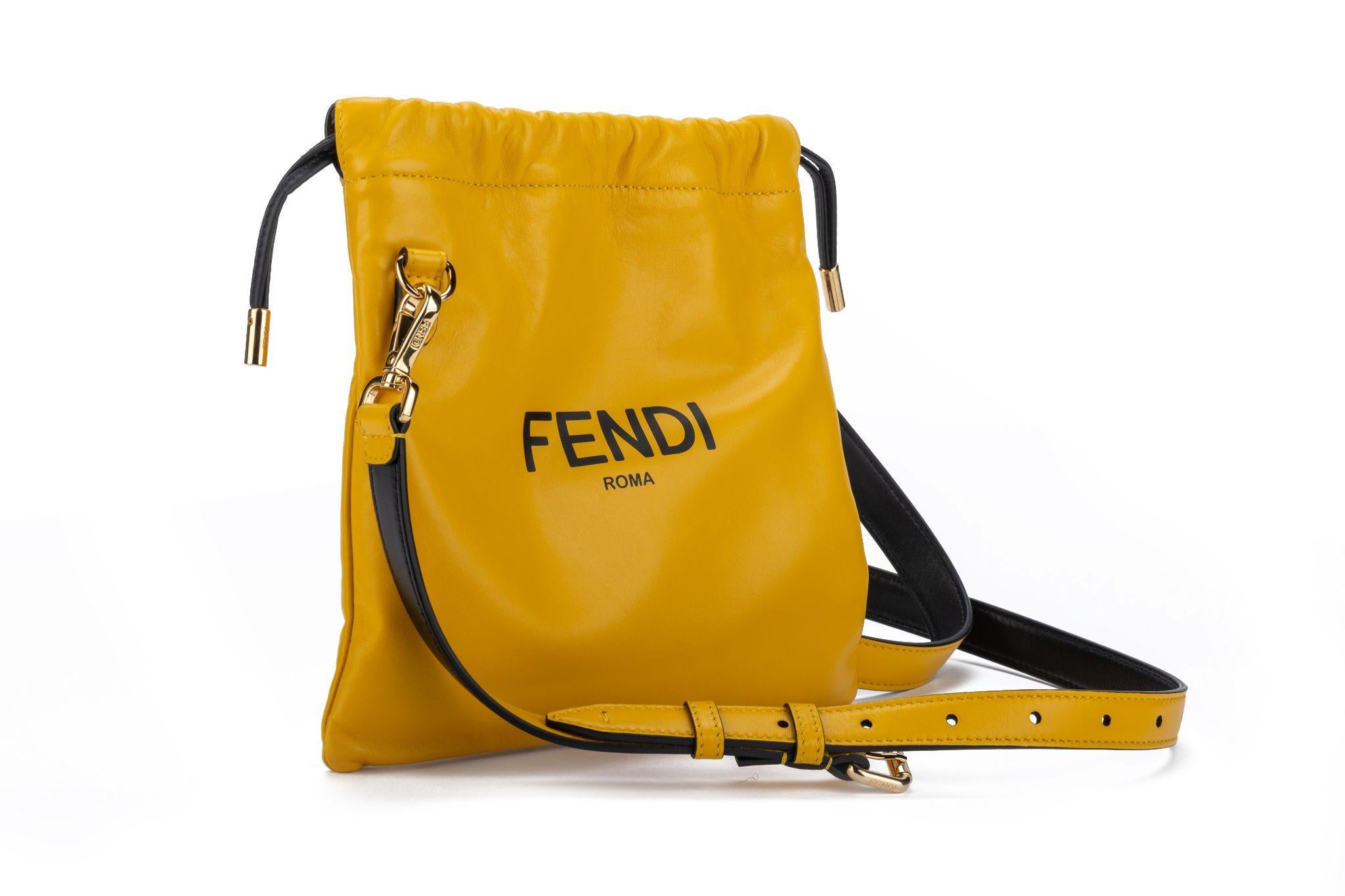 Fendi brand new small yellow lambskin cross body bag with black adn light gold details. 19 inches adjustable cross bod shoulder strap .Hardware in gold. Comes with booklet and dustcover.
