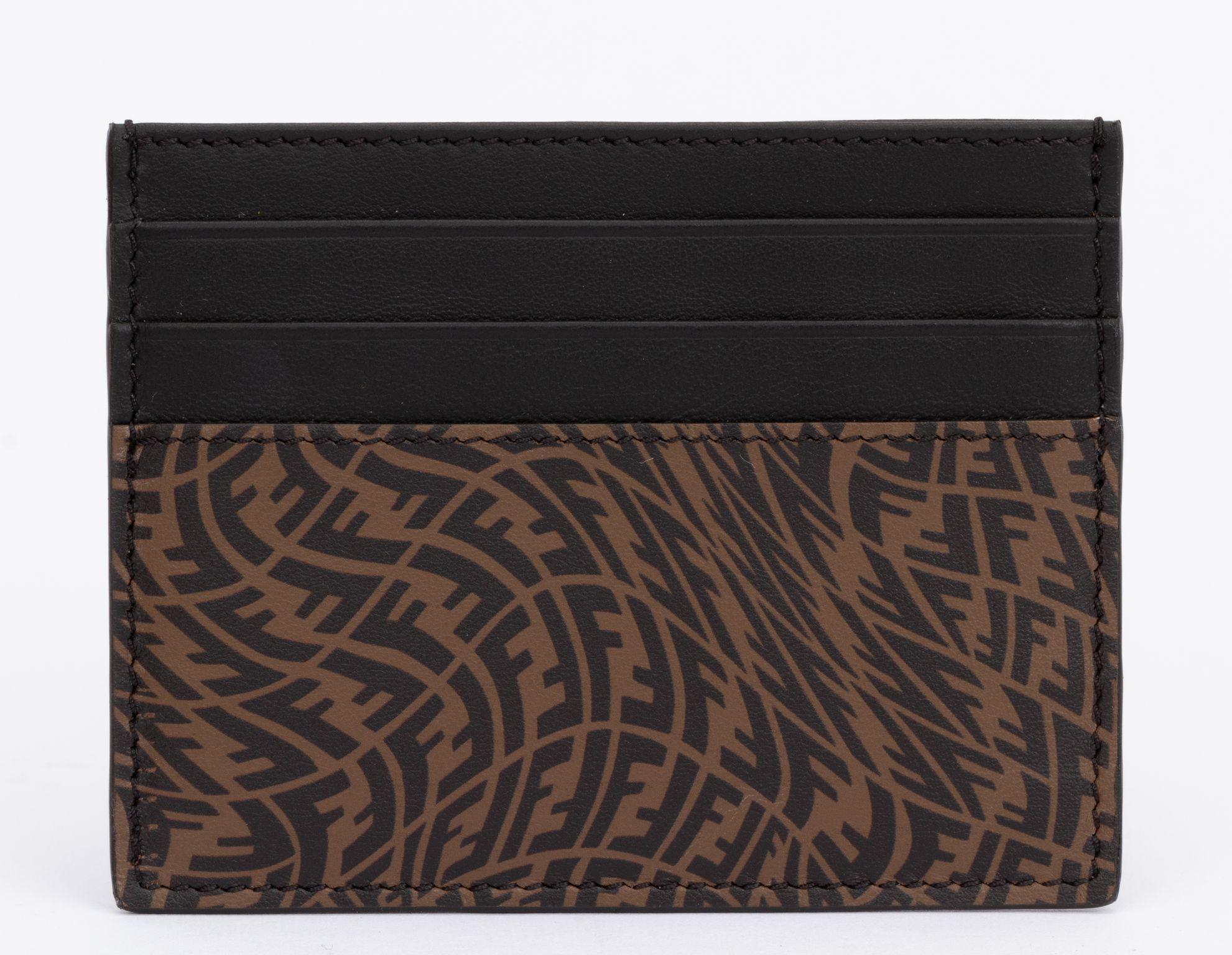 Fendi Black new brown and black vertigo print credit card case. Includes tag, original box and dust cover.