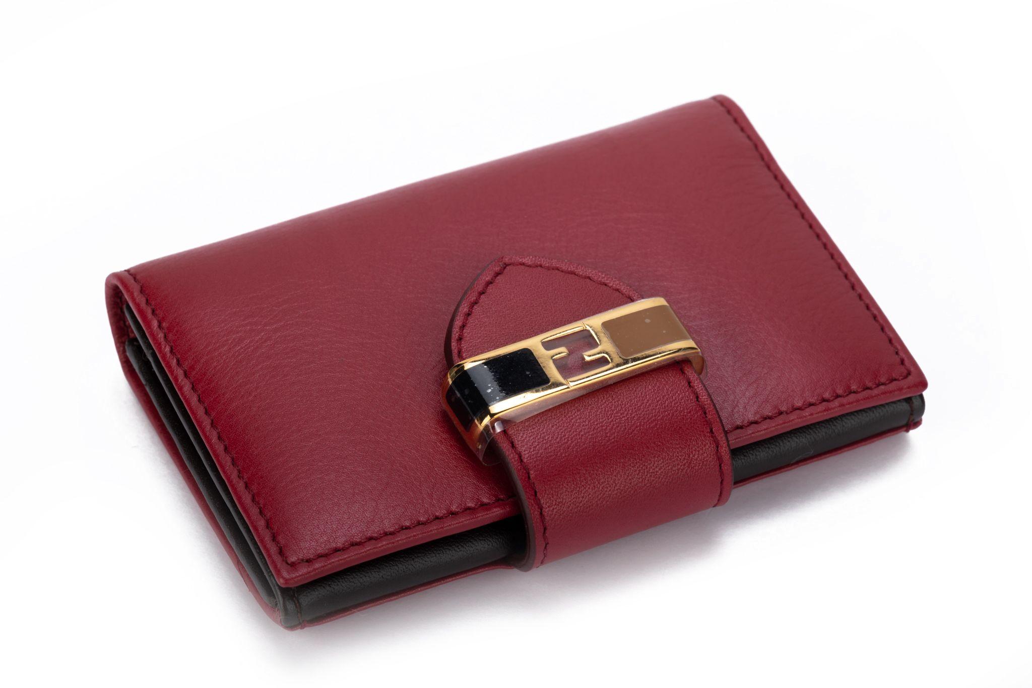 Fendi new burgundy veal wallet with enamel and gold hardware .
Box and original dustcover.