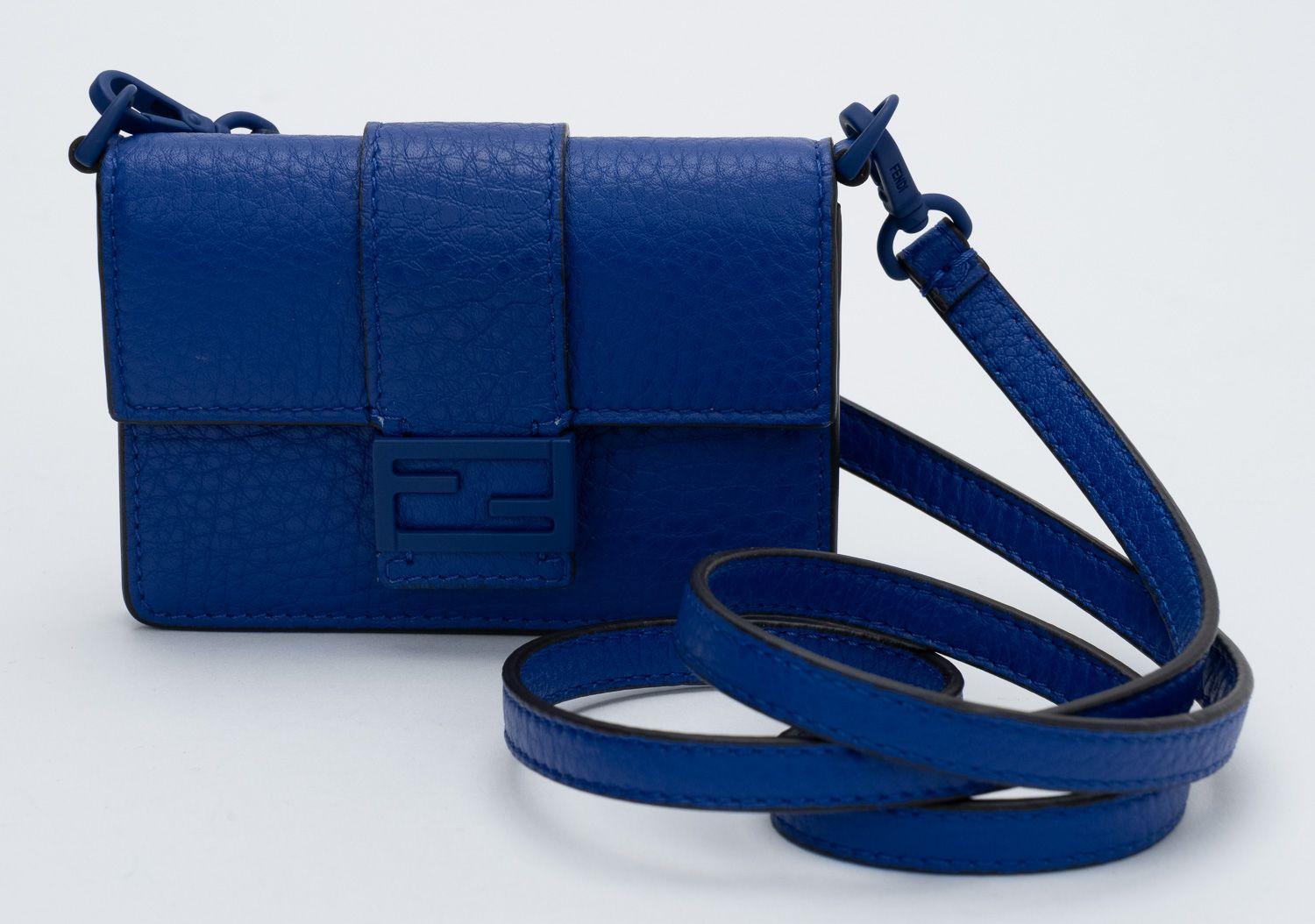 Fendi micro baguette in electric blue pebbled leather. Brand new in unworn condition. Fits credit cards and keys .Shoulder drop 18.5