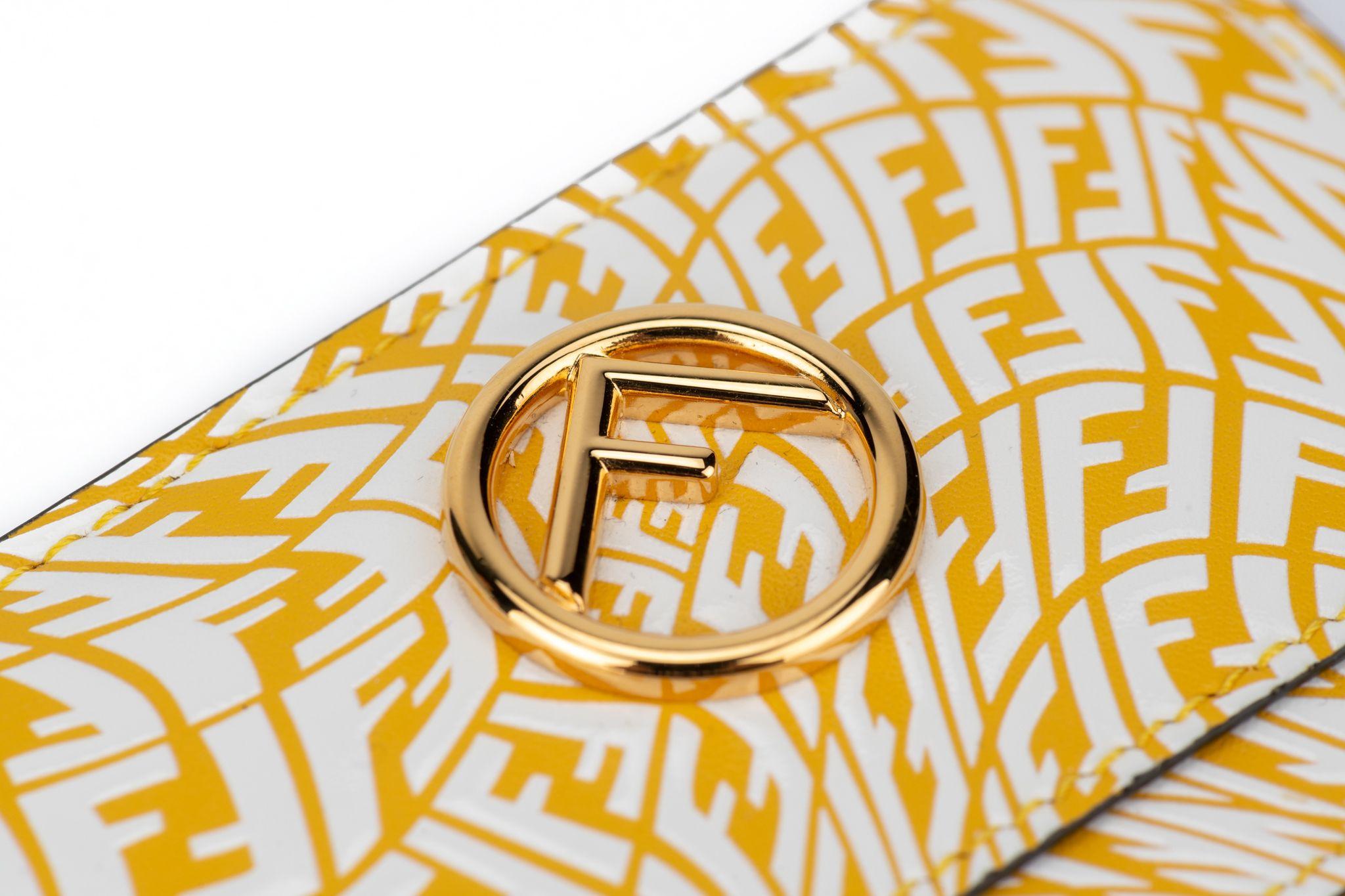 Fendi Porte-cartes de crédit imprimé vertigo noir, jaune et blanc. Boîte et jaquette d'origine.