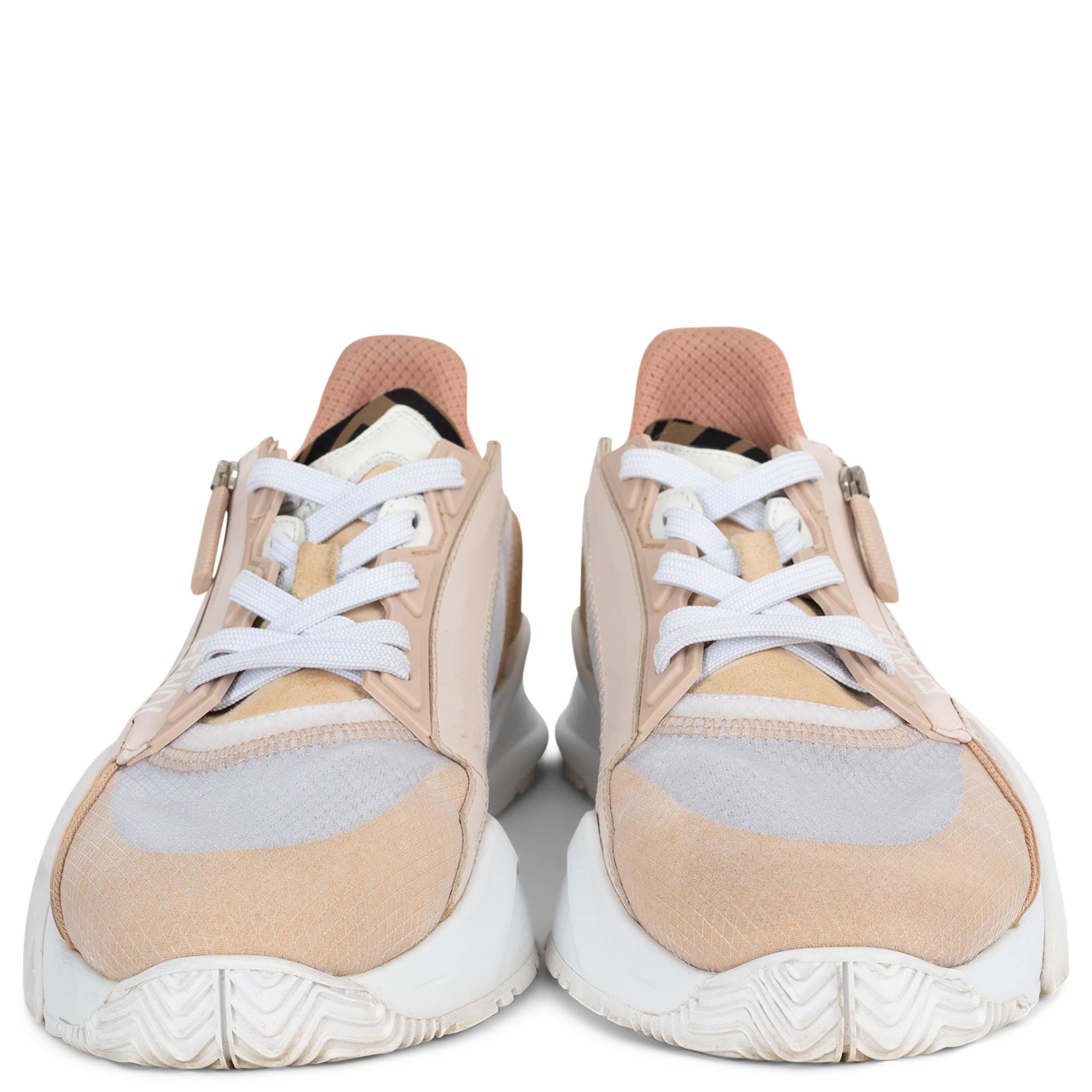 These 100% authentic Fendi Flow sneakers are crafted in nude pink and white nylon with tonal suede trims. Designed with a sporty, sculptural silhouette, they feature rounded toes, white rubber soles with the iconic diagonal F detail, and a rubber