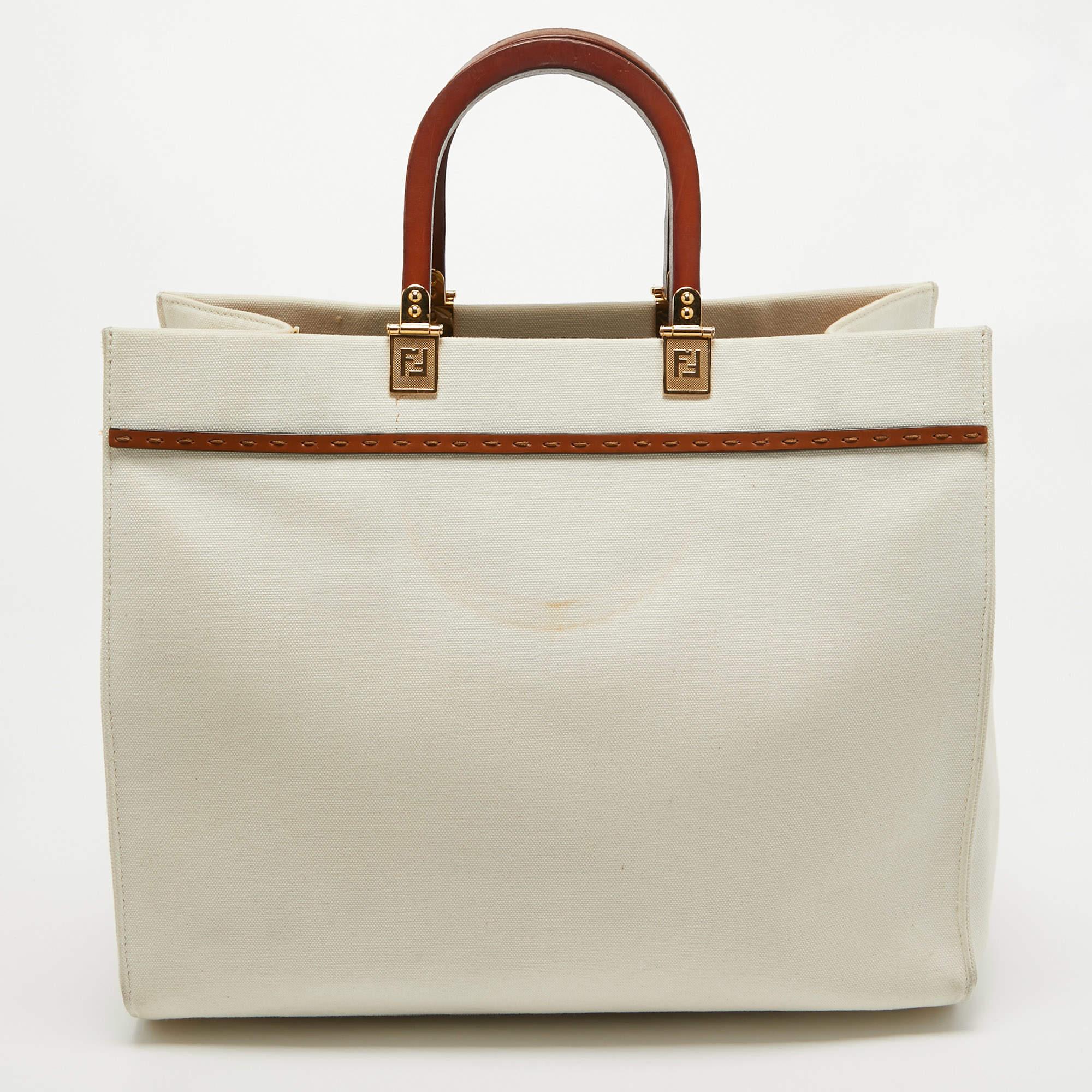 The architectural shape of this tote makes it distinct and fashionable. Made from premium materials, it can be carried around conveniently and it is equipped with a perfectly-sized interior.

Includes: Detachable Strap