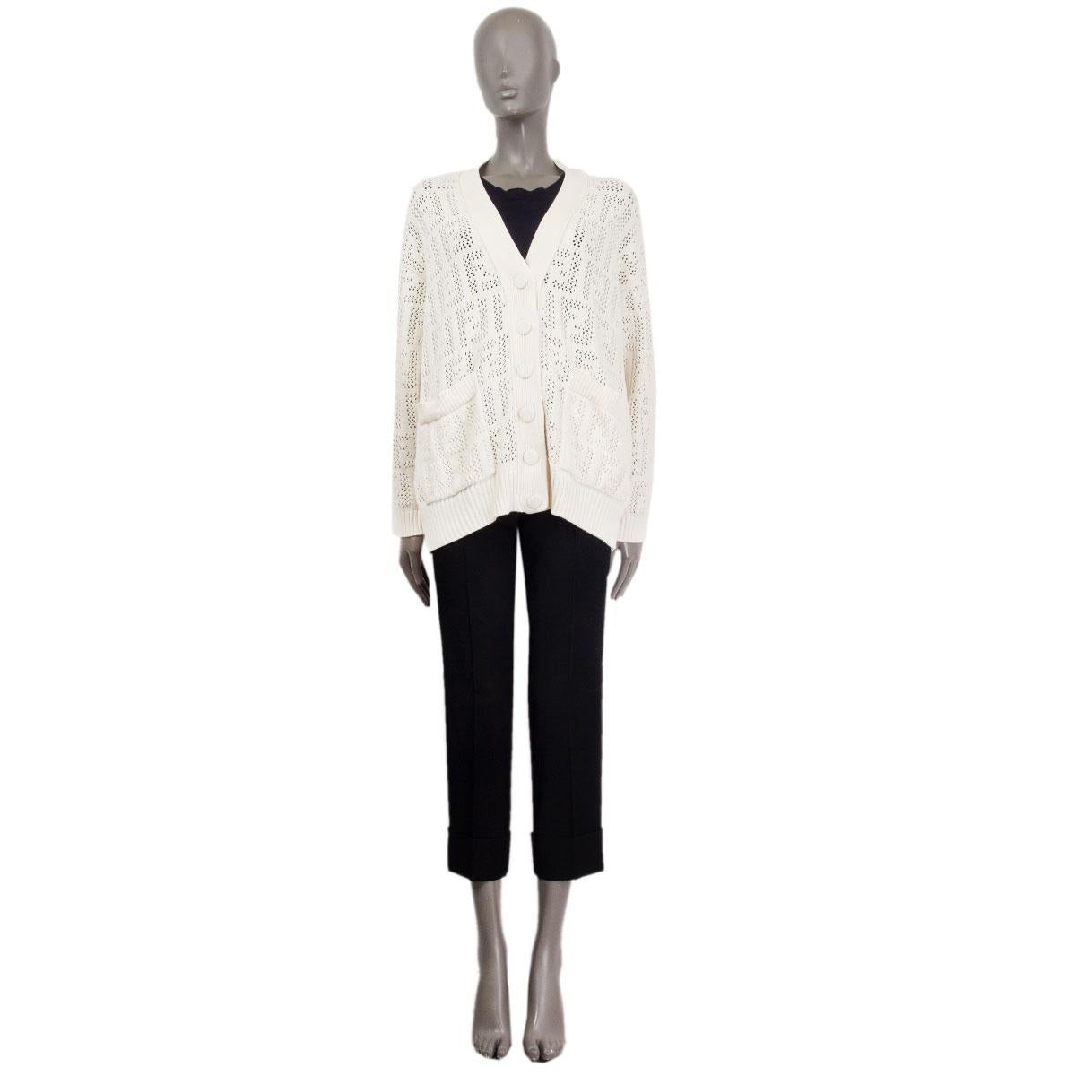 100% authentic Fendi perforated knit cardigan from Spring/Summer 2021 in off-white cotton (60%) and polyamide (40%). Features a loose-knit construction that artfully presents the house's iconic FF motif and it's shaped to a relaxed silhouette with