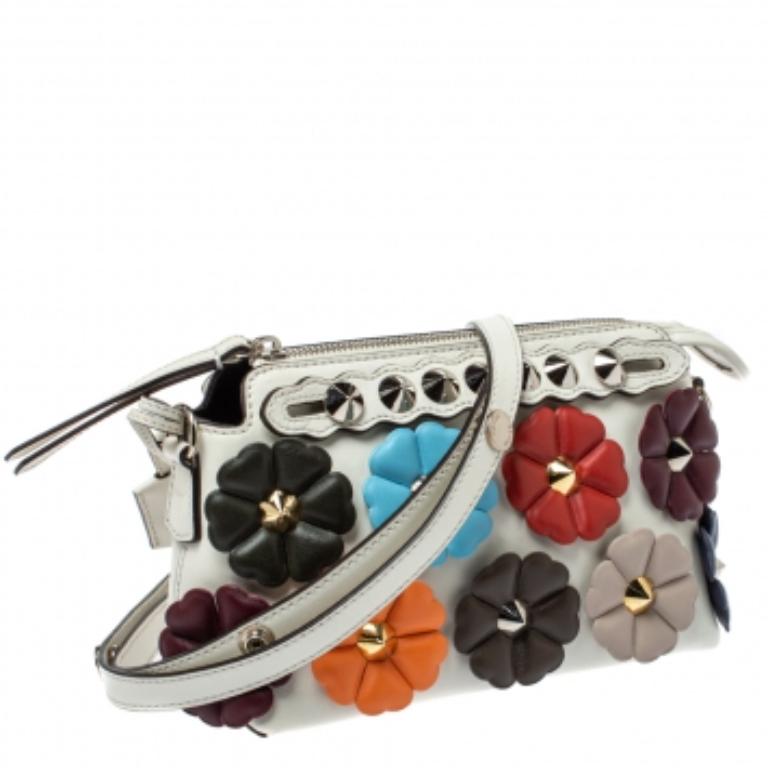 Structured, sophisticated, and stylish are some words that describe this crossbody bag! Crafted from best quality material, the creation is adorned with the label's signature appeal, held by comfortable handles, and equipped with a well-spaced