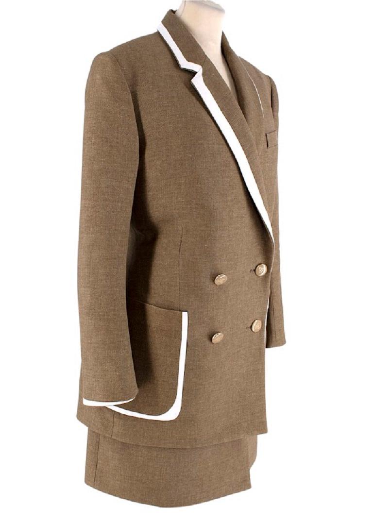 Fendi Old Gold Tweed Jacket & Skirt with Ivory Leather Trim 
 

 - Old-gold tone micro-tweed with a brown undertone, crafted from a wool-silk thread
 - 40's inspired cut, with a double-breasted notched lapel, trimmed with a light ivory leather 
 -