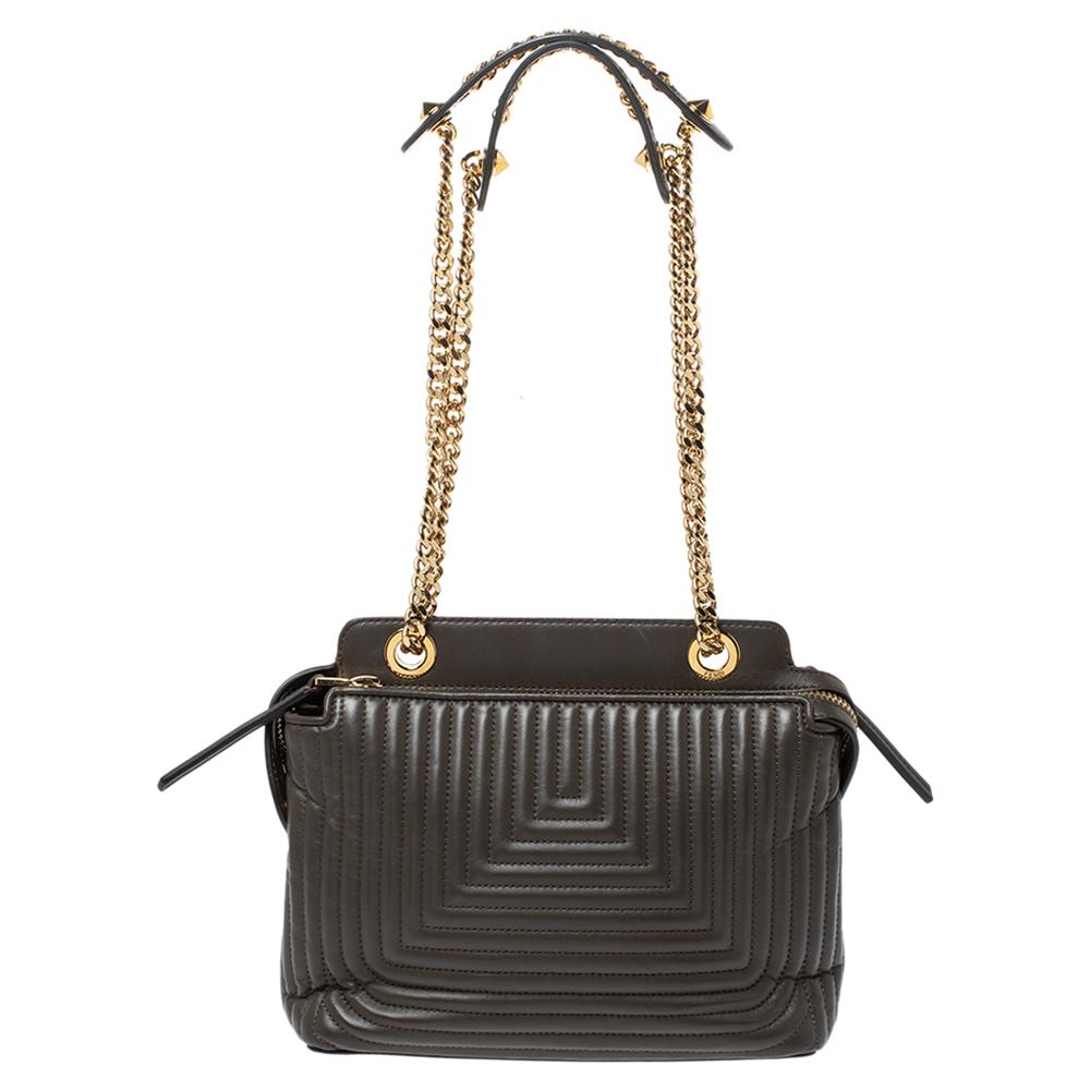 We are in love with this Dotcom bag from Fendi. Wonderfully crafted from leather, the bag has a silhouette that is functional. It has a quilted exterior, and the top zipper reveals suede interiors capacious enough to carry your essentials. The bag