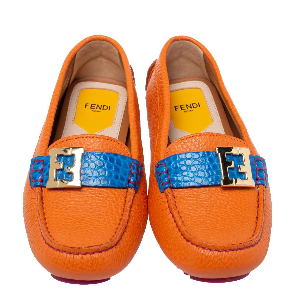 Fendi understands your need for comfort and style in these loafers. Crafted in Italy, these loafers are made of orange leather. They flaunt a contrasting strap made from croc-embossed leather on the uppers that carry the iconic FF logo in gold-tone.
