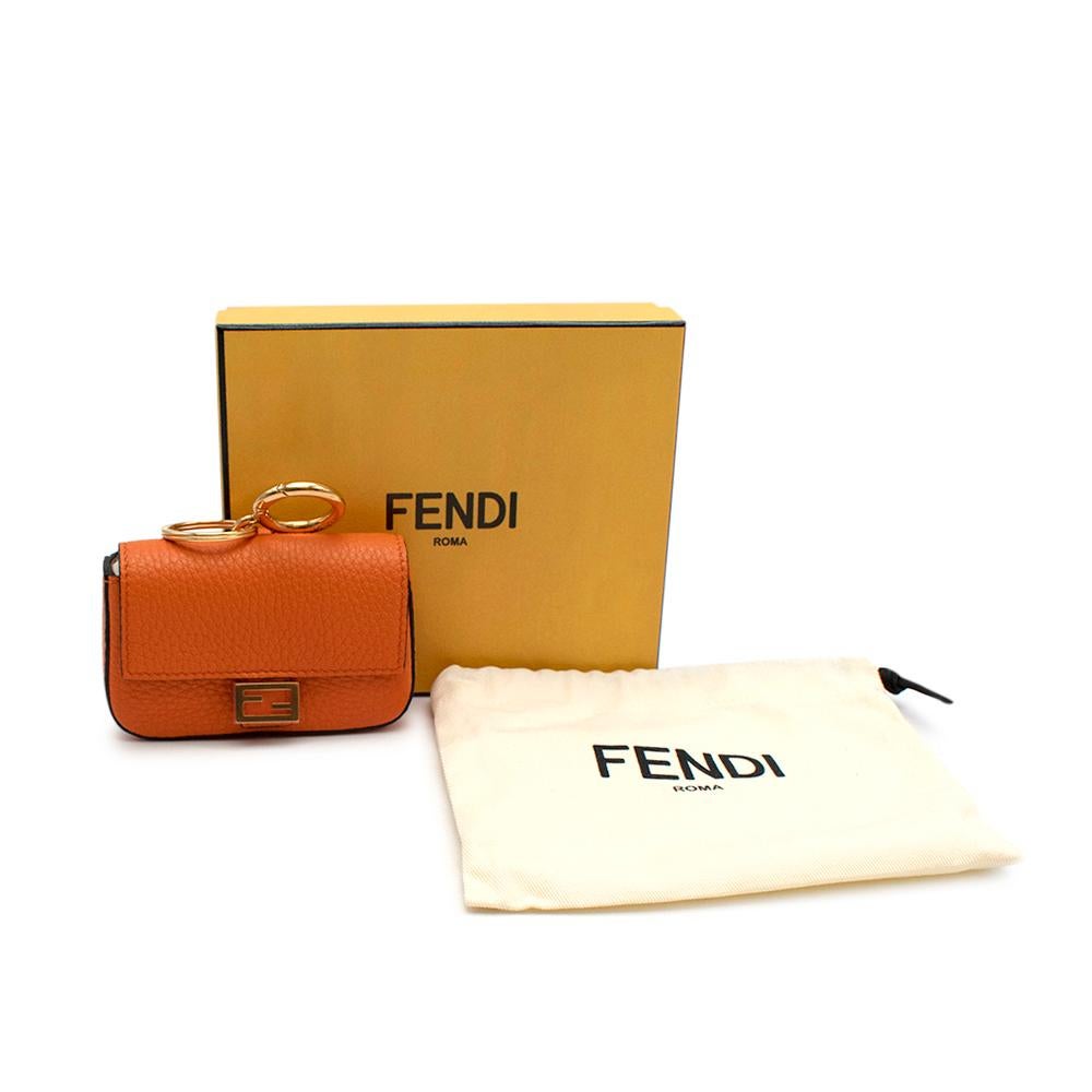 Fendi Orange Leather Nano Baguette Charm

Iconic Baguette bag in micro version, with flap and FF fastening. The clip key ring  on the back allow it to be attached to larger bags or belts. Lining with flat pocket. Made of Cuoio Romano leather. Beige