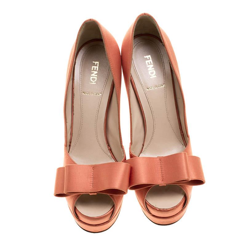 These exquisite pumps from Fendi are worth splurging on. Crafted from orange satin, these pumps flaunt peep toes with pretty bows on the uppers and the platforms and the 14 cm heels are sure to lend your personality oodles of confidence. Walk in