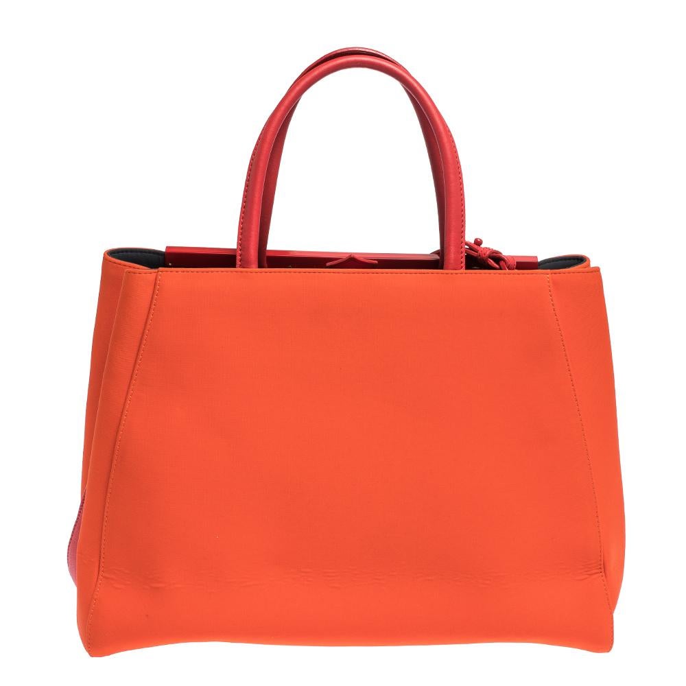 Fendi's 2Jours tote is one of the most iconic designs from the label and it still continues to receive the love of women around the world. Crafted from orange neoprene and leather, the bag features stud detailing and double rolled handles. It is