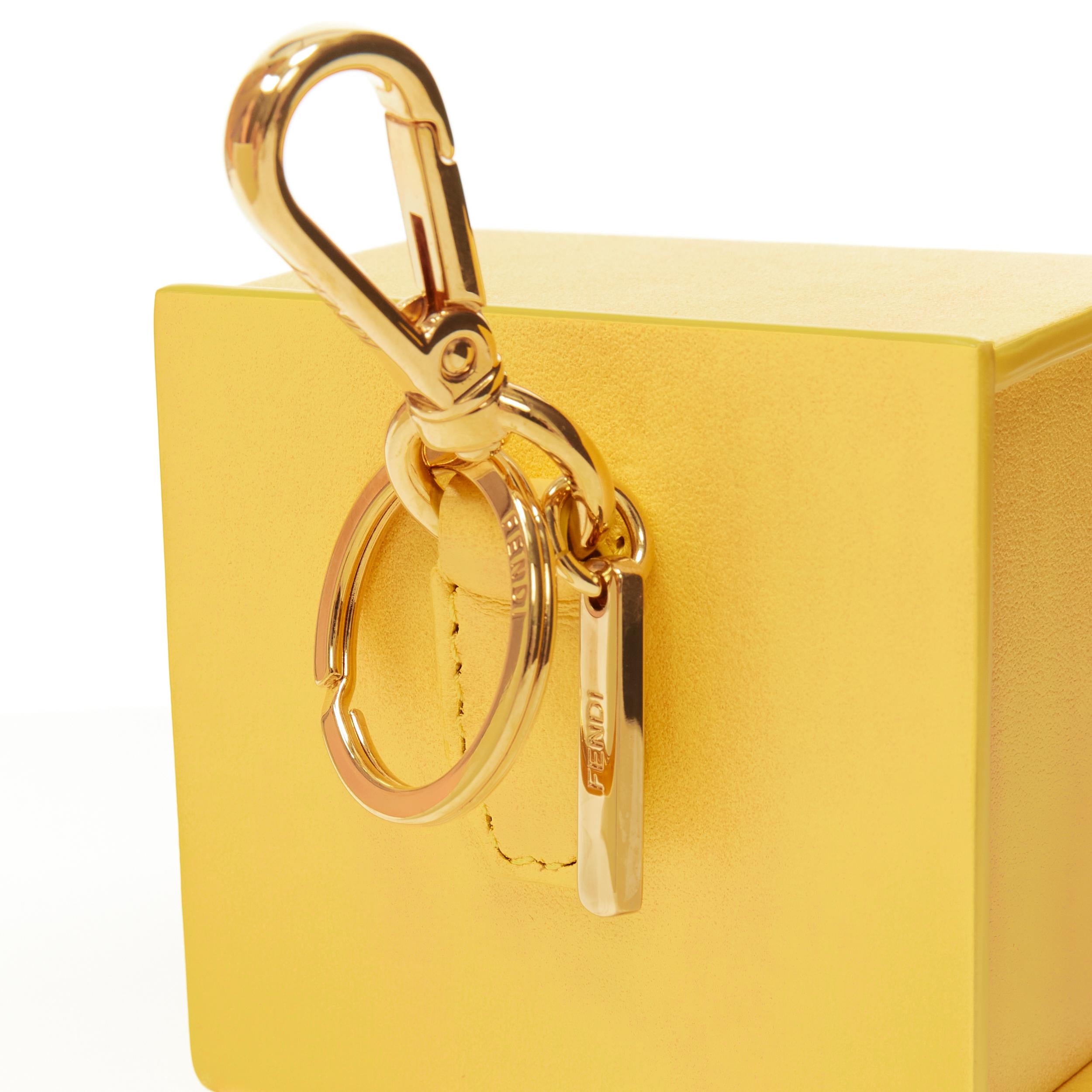 FENDI Pack full leather yellow black logo packaging box bag char keyring 
Reference: ANWU/A00139 
Brand: Fendi 
Collection: Fendi Pack 
Material: Leather 
Color: Yellow 
Pattern: Solid 
Extra Detail: Gold-tone hardware. Please note the box purely a