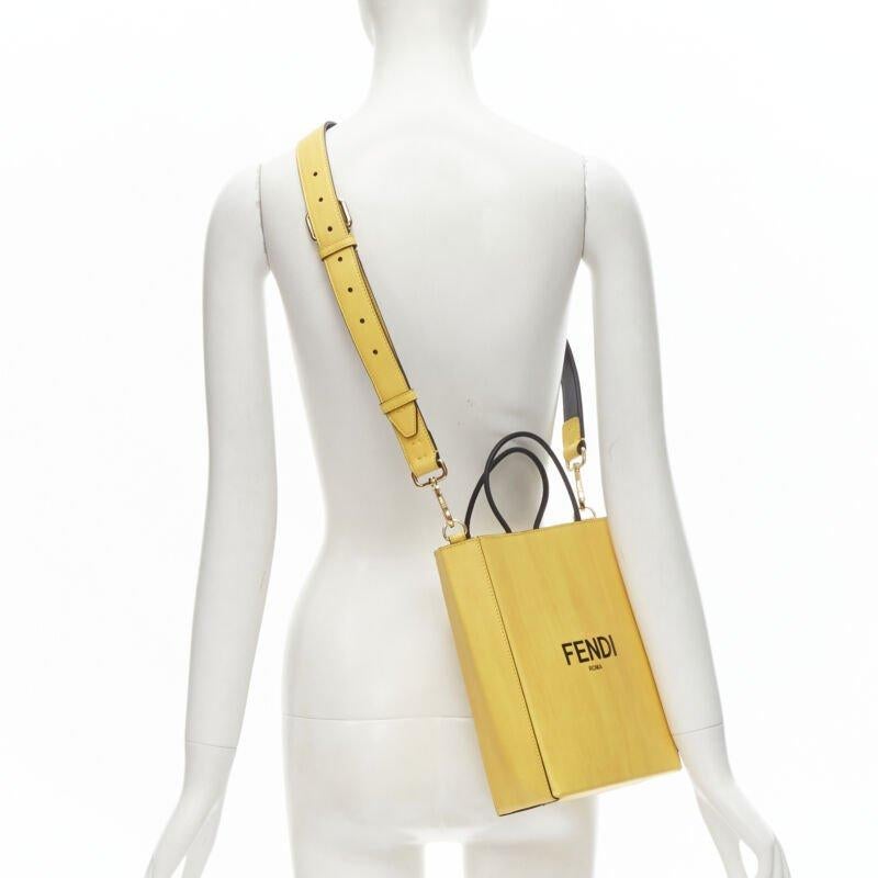 FENDI Pack Small Shopping yellow leather logo print crossbody tote bag
Reference: ANWU/A00027
Brand: Fendi
Collection: Fendi Pack - Runway
Material: Leather
Color: Yellow, Black
Pattern: Solid
Closure: Magnet
Lining:  Leather
Extra Details: Leather