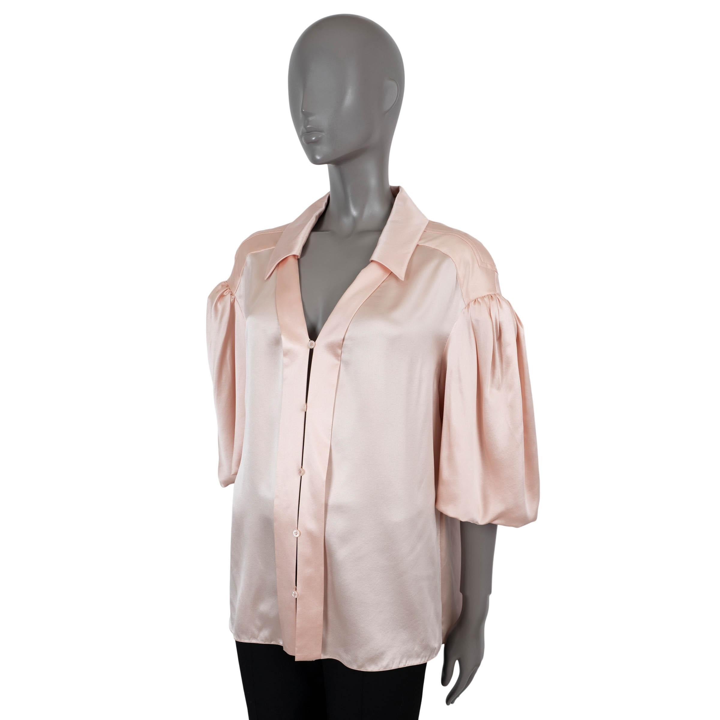 100% authentic Fendi blouse in light salmon satin silk (100%). Features an oversized fit with dropped shoulders and short puff sleeves, a V-neck and side slits. Closes with buttons on the front and is unlined. Has been worn and is in excellent
