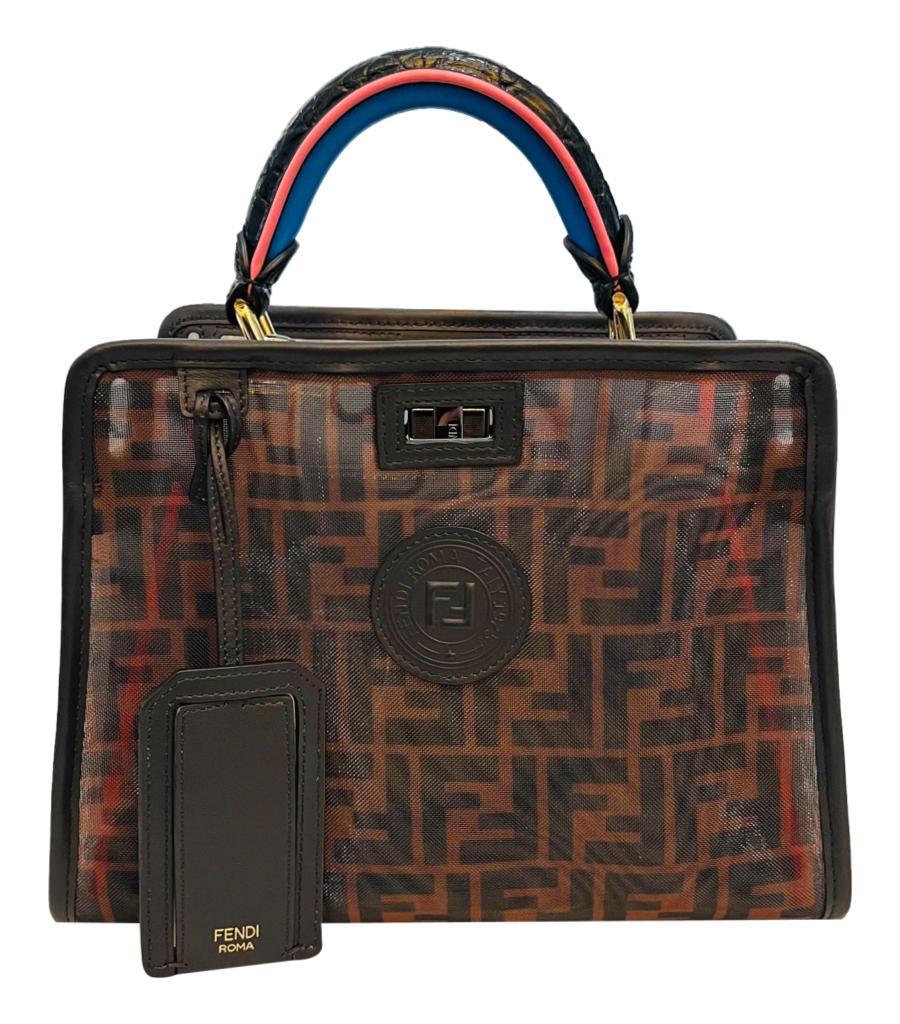 Rare Item - Fendi Patent Leather Peekaboo Bag With 'FF' Defender Cover Bag

Black handbag crafted in glossy patent leather and detailed with contrasting red trims.

Designed with single top handle in black, pink and blue and detachable shoulder