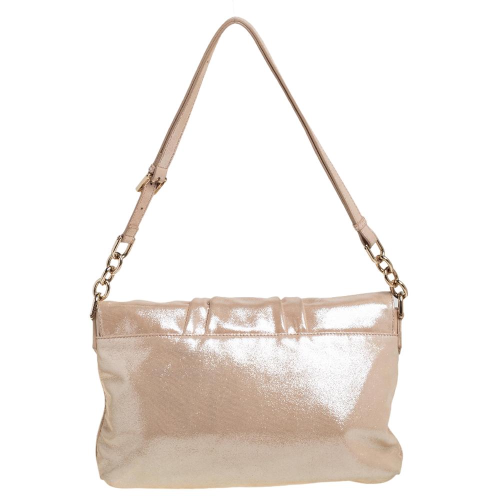 Complete a winning look with this Mia shoulder bag from Fendi. Crafted from shimmer leather, the front flap comes with a striking gold-tone FF that reveals a spacious interior sure to fit in your everyday essentials. The handle further adds an edge