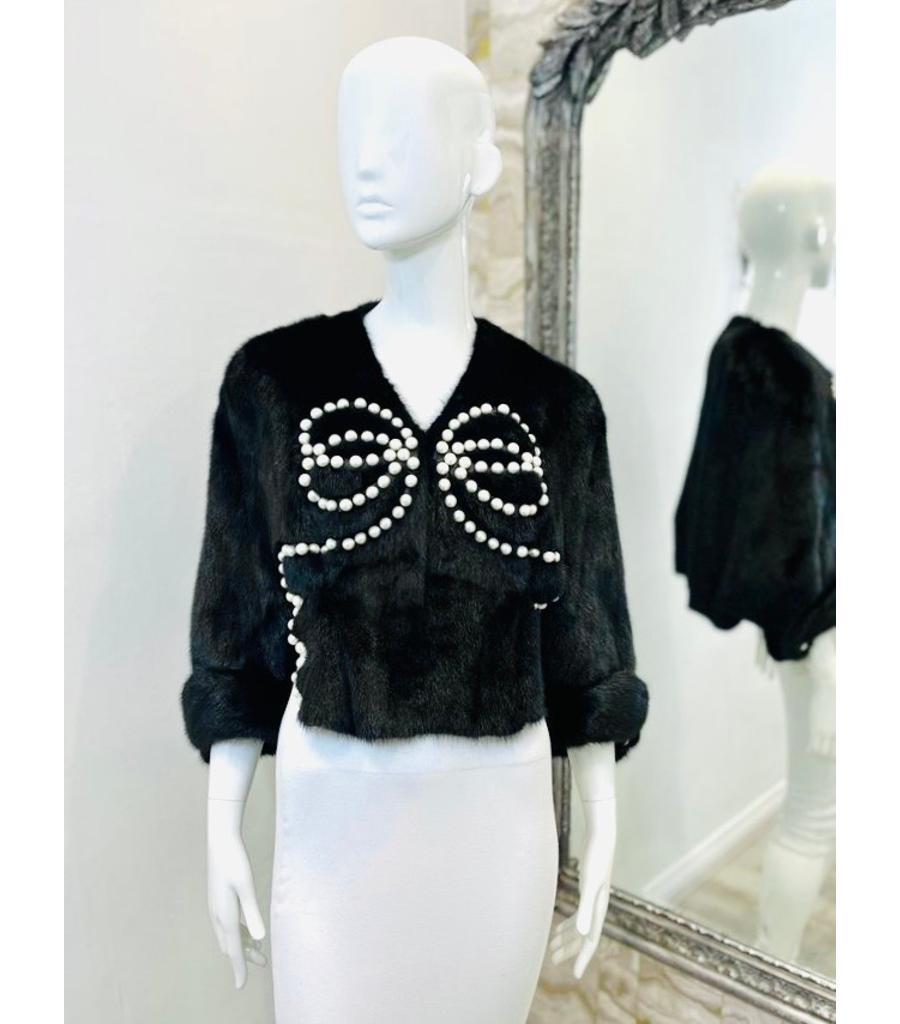 Fendi Pearl Embellished Mink Fur Jacket

From 2018 - Ribbons & Pearls Resort Collection

Black, cropped jacket designed with white faux pearl embellishment to the front.

Featuring pearl-buttoned cuffs in three-quarter sleeves and