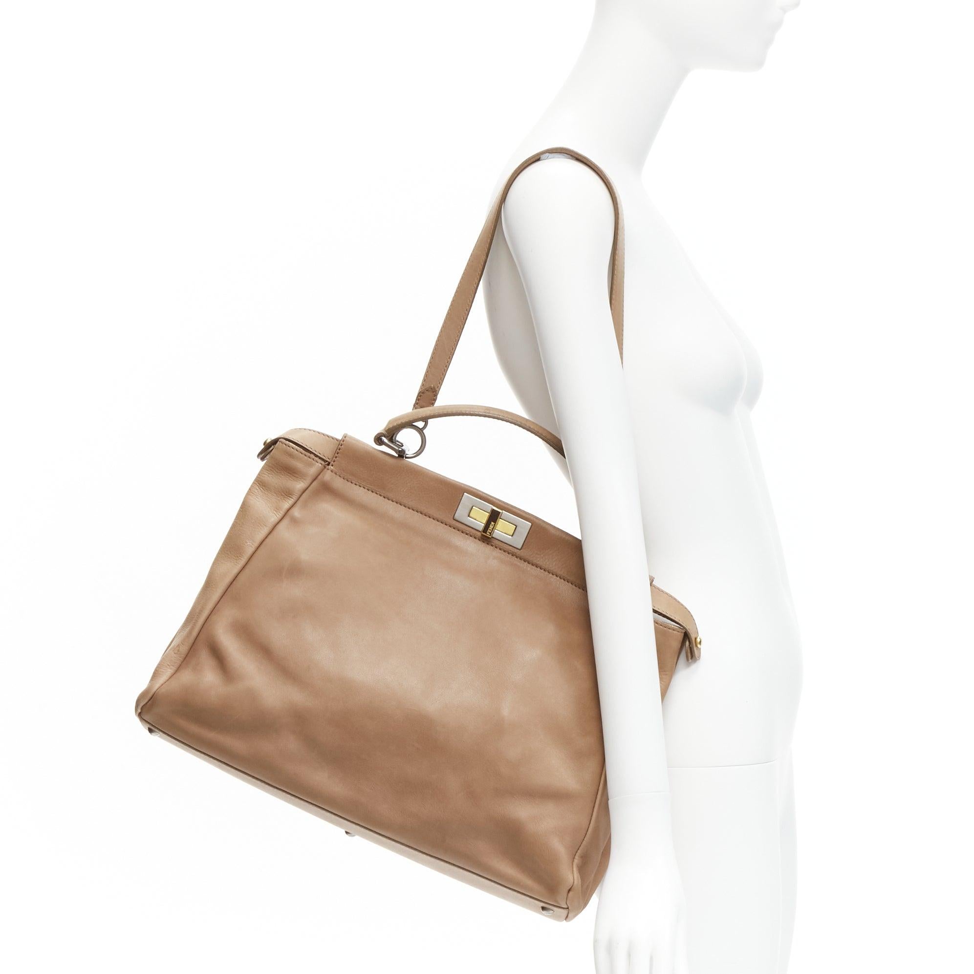 FENDI Peekaboo brown soft leather mixed metal turnlock top handle shoulder bag
Reference: GIYG/A00309
Brand: Fendi
Model: Peekaboo
Material: Leather
Color: Brown
Pattern: Solid
Closure: Turnlock
Lining: Brown Leather
Extra Details: Scaled leather