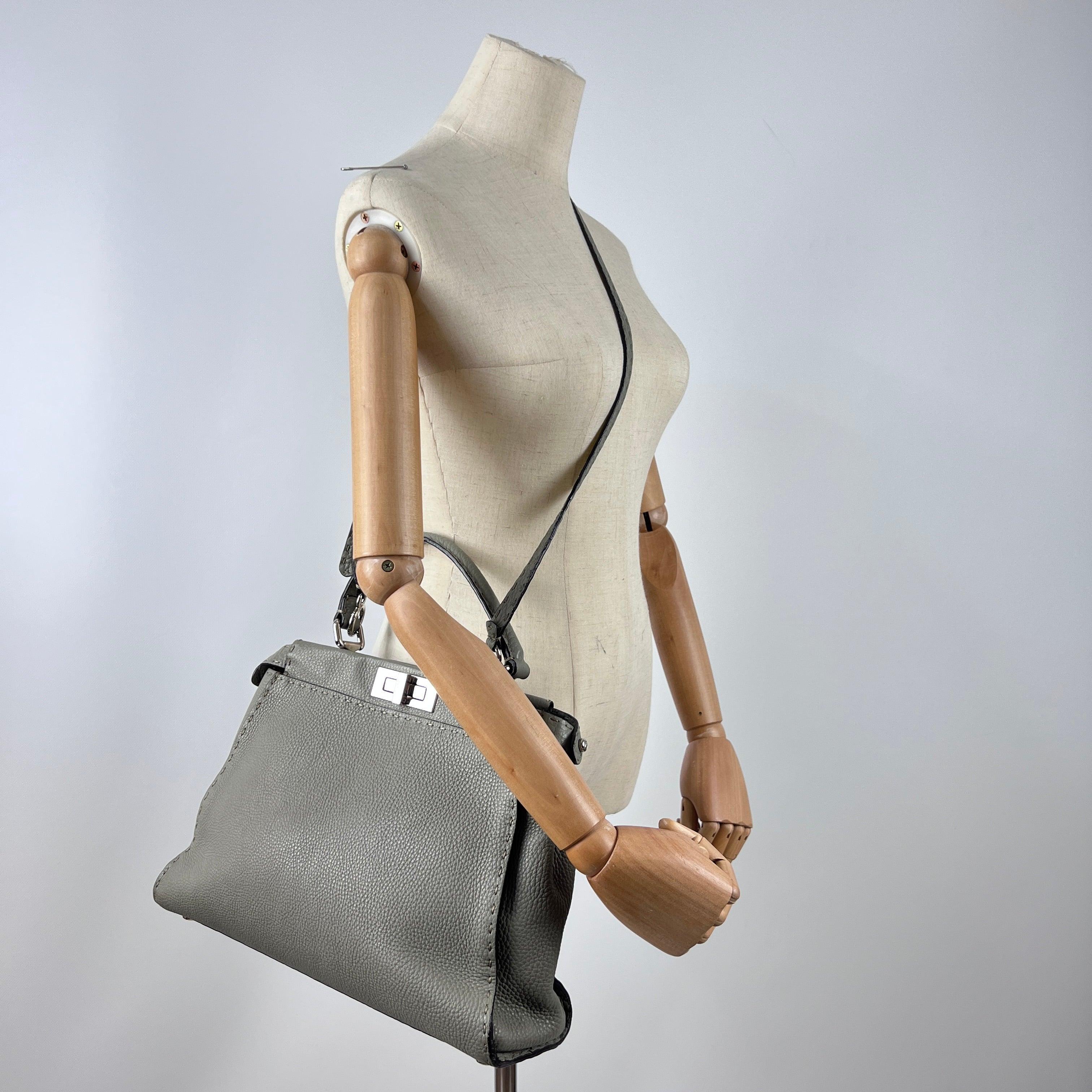 Magnificent Fendi Peekaboo in gray leather with silver-tone hardware and turn-lock closures. Two main compartments divided by a zipped pocket, with top handle and removable shoulder strap. A refined creation by Silvia Venturini Fendi from the late