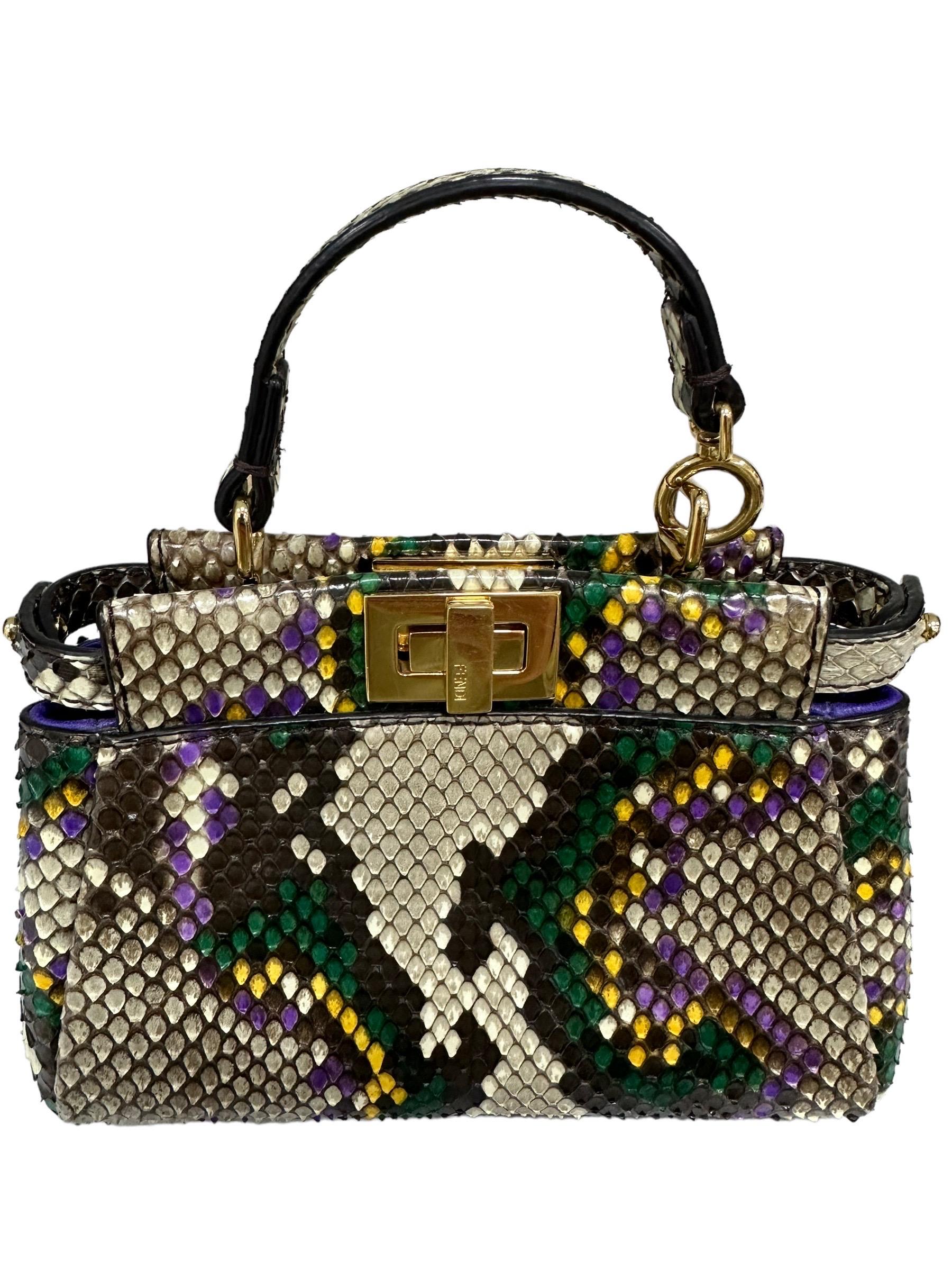 Bag by Fendi, Peekaboo line, IseeU model, size Micro, made of multicolor leather with gold hardware. Equipped with two openings with twist lock, internally covered in smooth purple leather, minimum capacity. Equipped with a central handle in rigid