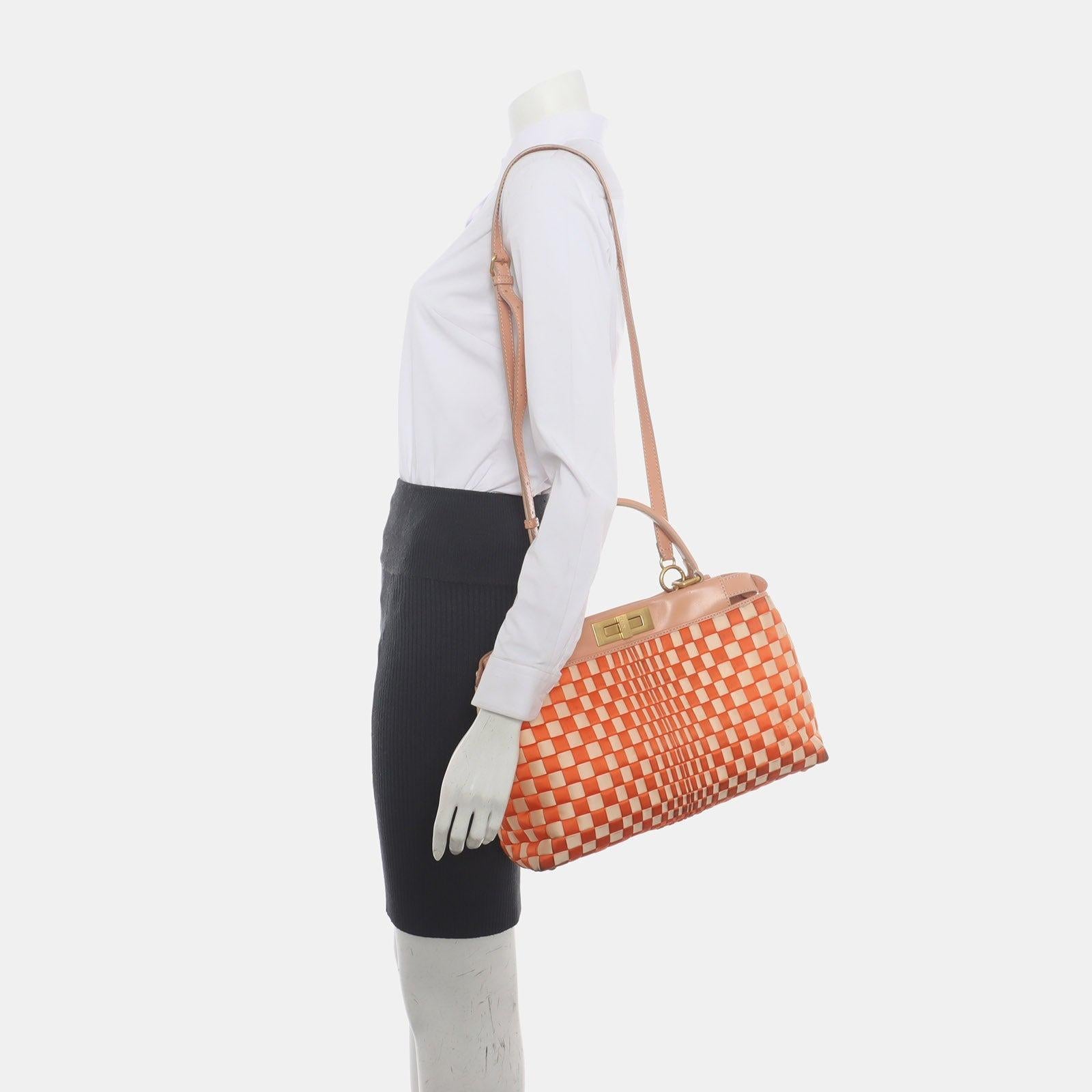 Fendi Peekaboo Medium Fabric Leather Intreccio Orange Handbag
 These are professional photos of the actual bag offered by Luxbags.
 CONDITION: Good
 This preloved item is in good condition with heavy signs of use. Heavy stains on the corners. Stains