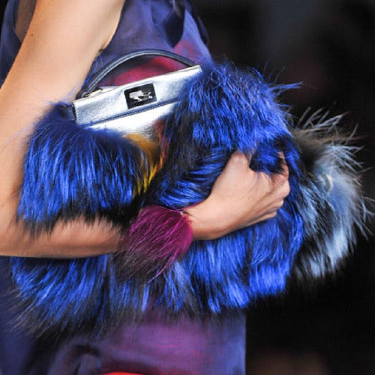 Fendi Peekaboo Mini Fox Fur Blue Limited Edition 2014
 These are professional photos of the actual bag offered by Luxbags.
  
 This limited edition Fendi Peekaboo Mini Fox Fur bag is a stylish attention-grabber for the winter season. The unique blue