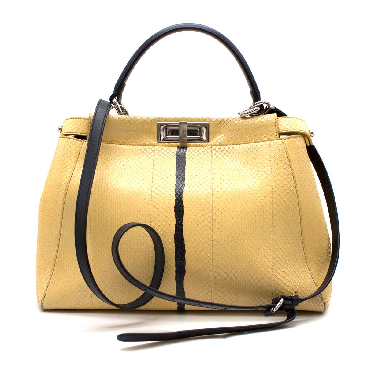 Fendi Peekaboo Regular Yellow Snakeskin Handbag

- Yellow Peekaboo Python Handbag
- Regular size
- Two-tone contrasting details
- Single top handle
- Adjustable and detachable shoulder strap
- Two internal compartments divided by a stiff partition
-
