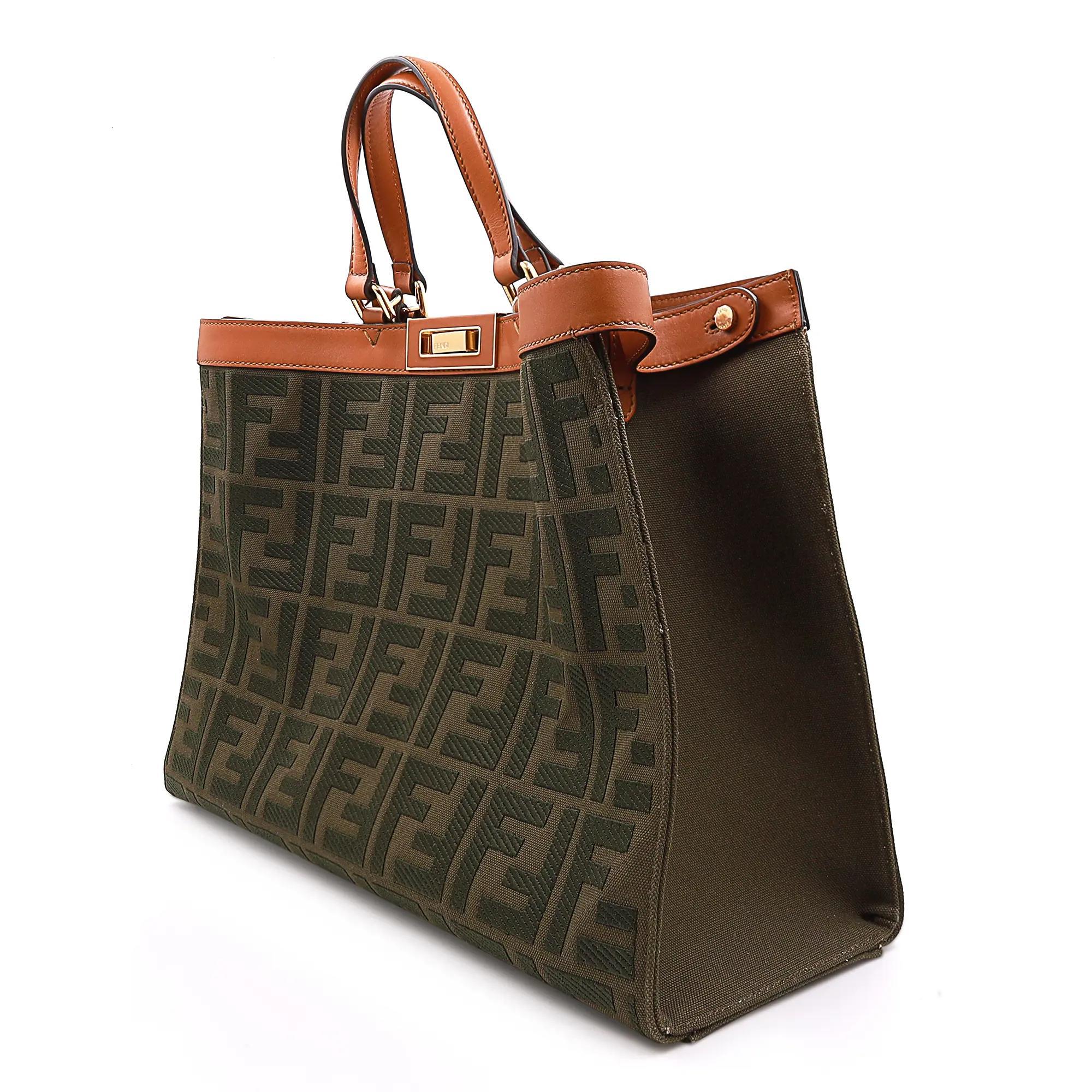 Fendi Peekaboo X-Tote Canvas Medium Green Handbag. Featuring embossed and embroidered Fendi motifs on green color canvas with brown trimmed leather. One interior pocket with press-stud. Gold tone hardware. Two small handles with two long handles for