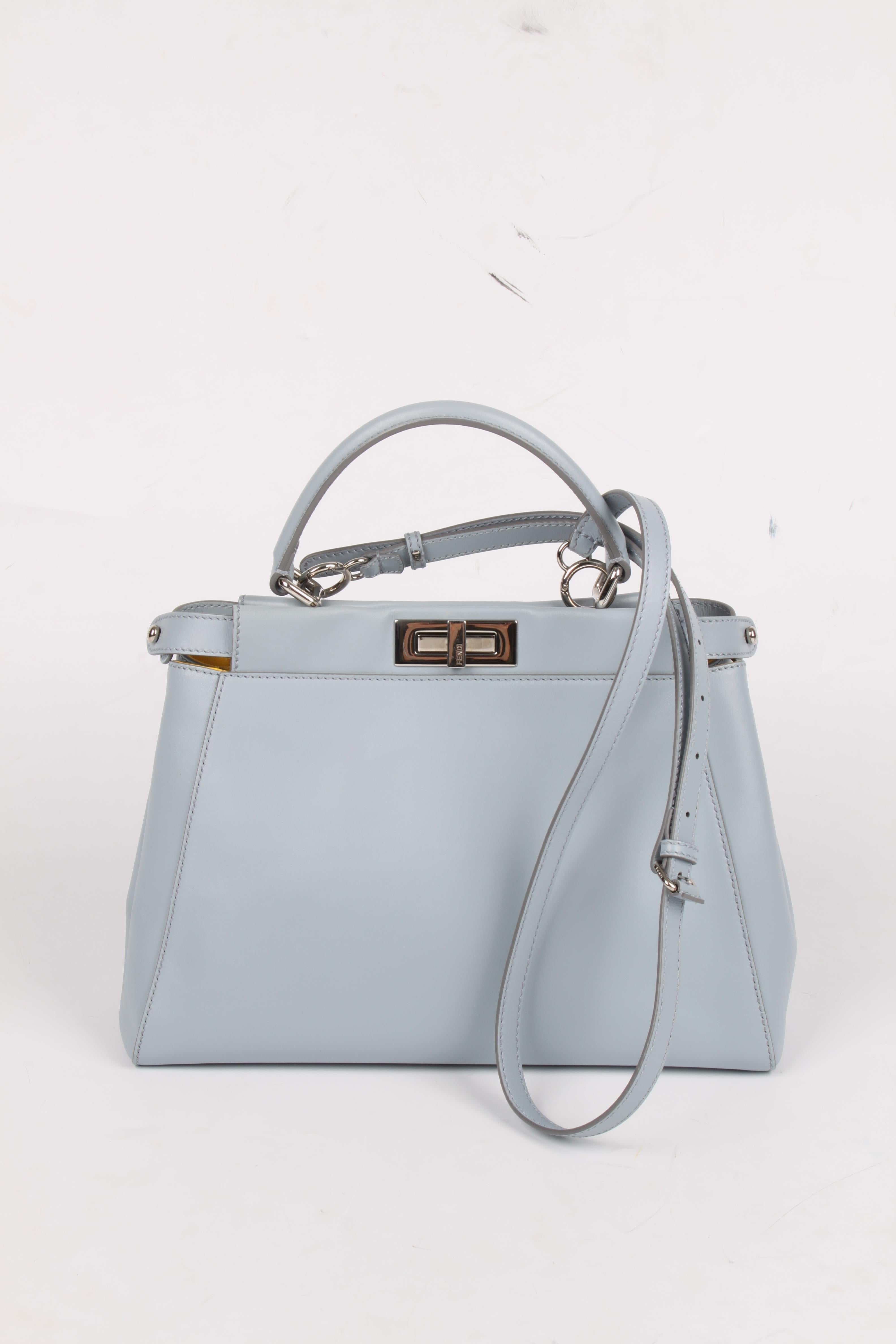 This is the Fendi Peekaboo Bag Medium, a really nice and iconic piece!

Introduced in 2009, but now again a very very popular bag. Very manageable size and practical due to the two large compartments that can each be locked with their own twist lock
