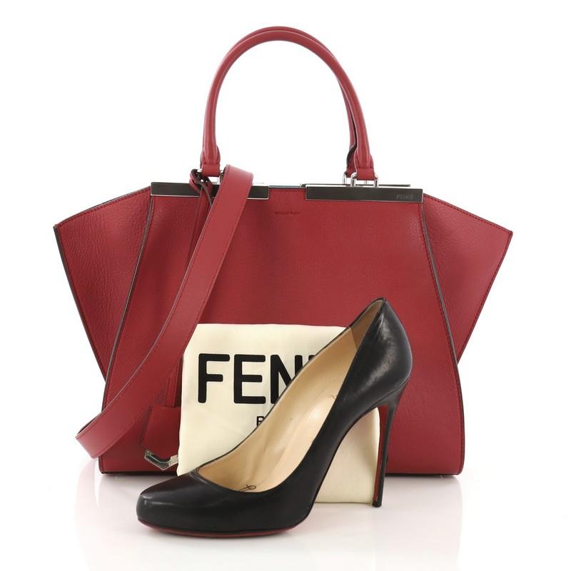 This Fendi Petite 3Jours Handbag Leather, crafted from red leather, features a split top bar with the Fendi brand name, dual rolled leather handles, and silver-tone hardware. Its zip closure opens to a blue leather interior with slip pockets.