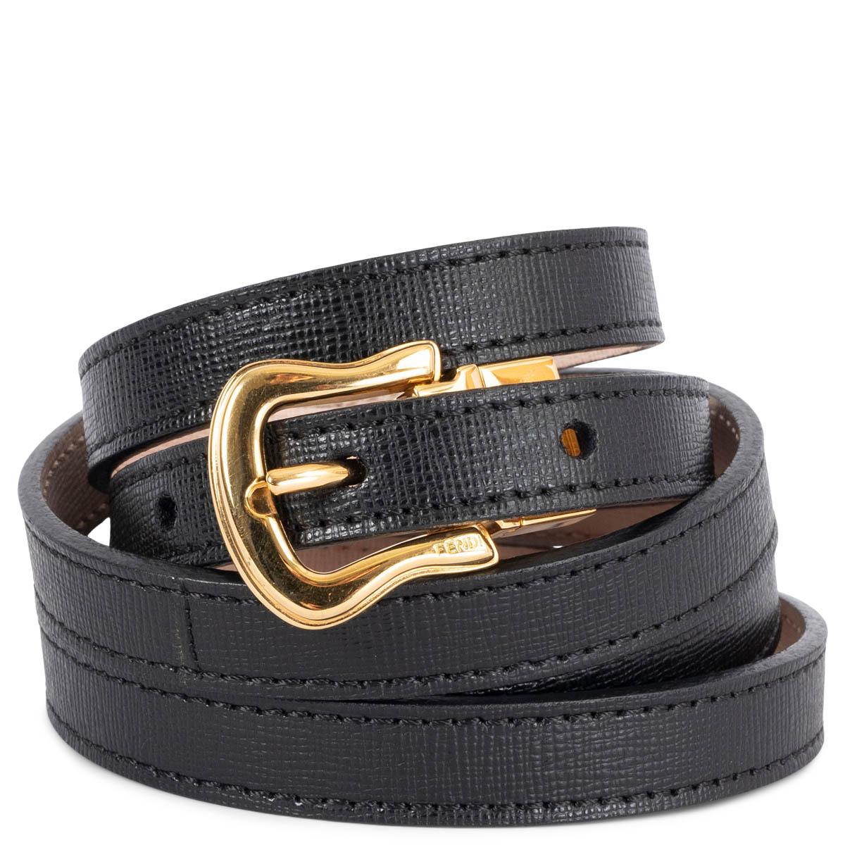 100% authentic Fendi reversible double wrap waist belt in black and pink saffiano leather with a gold-tone metal buckle. Has been worn and is in excellent condition.


Measurements
Tag Size	75
Width	1.2cm (0.5in)
Fits	139cm (54.2in) to 150cm