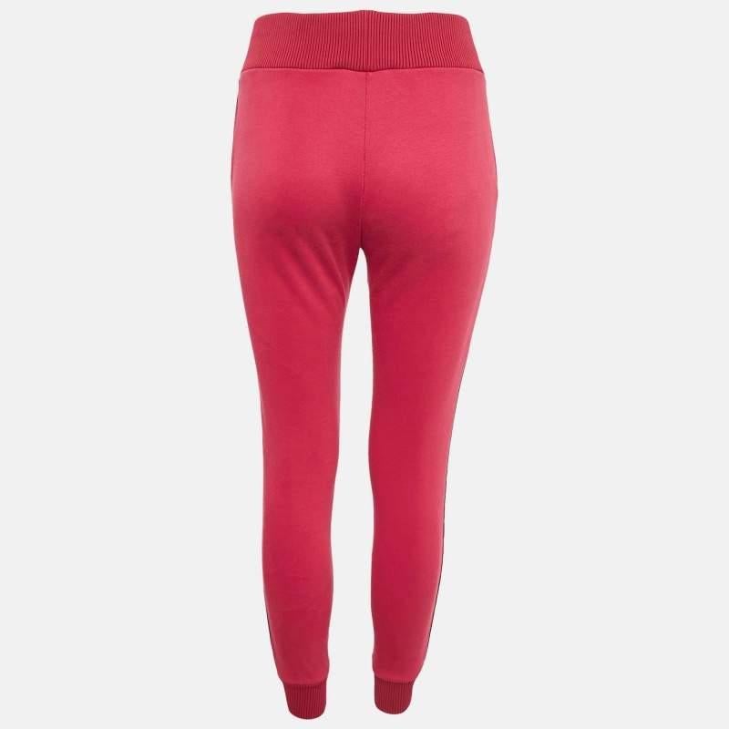 A work from home or stay at home fashion staple  track pants are the ultimate comfort clothing to wear these days. This pair is by Fendi. Made from cotton knit fabric  the pair comes in pink with the logo strip detail on the sides.
