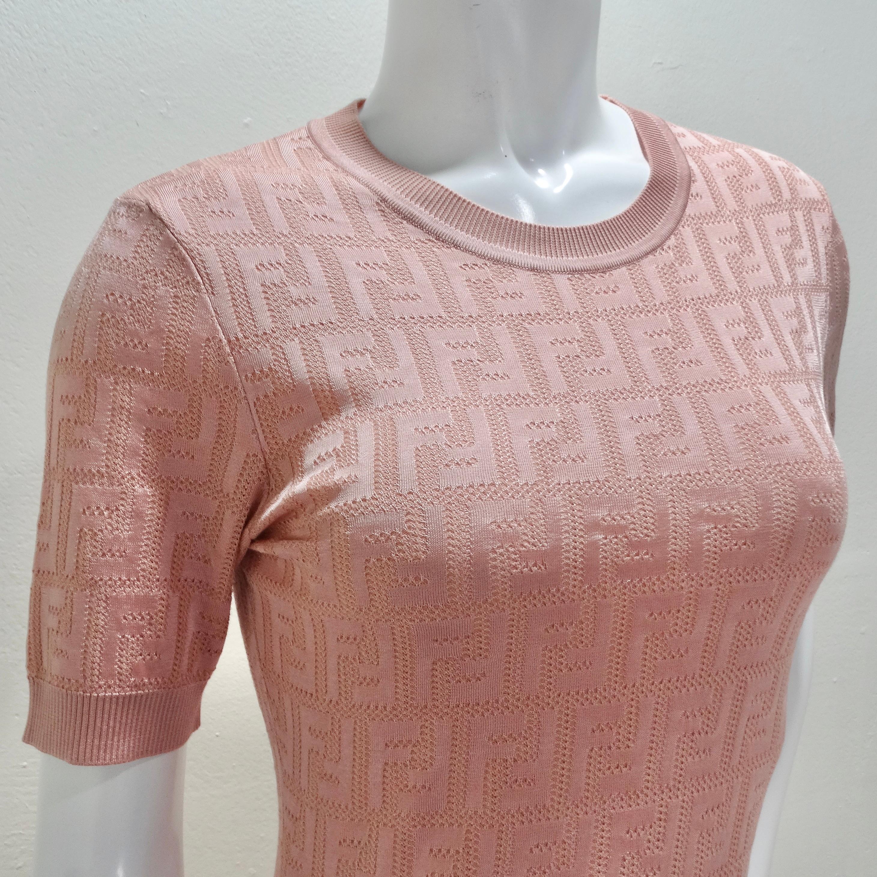Introducing the Fendi Pink Jacquard Monogram Crewneck Dress, a stunning piece that combines classic elegance with modern sophistication. Crafted from a luxurious jacquard cotton blend, this lightweight knitted dress features a timeless crewneck